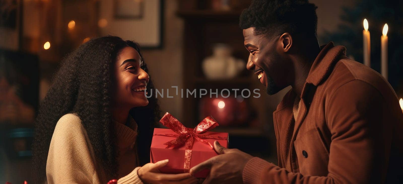 A young African-American black couple with curly hair in love, a man and a woman. A chic, happy man gives a gift in a box to a beautiful smiling woman, with care and love. by Alla_Yurtayeva