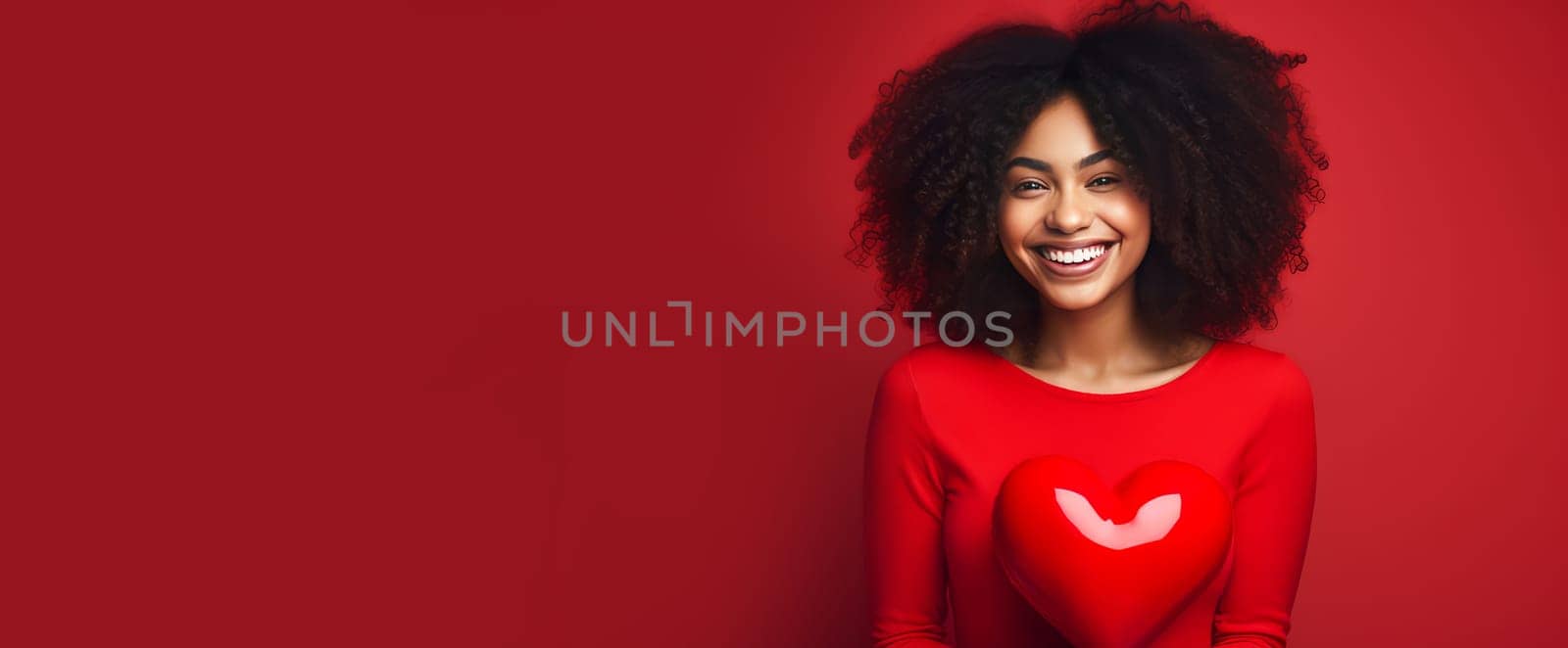 Happy, elegant, laughing, carefree girl African American dark-skinned, woman with heart on red background for Valentine's day, banner, advertisement. Valentine's day, newlyweds, engagement, holiday, birthday, wedding, anniversary, surprise date