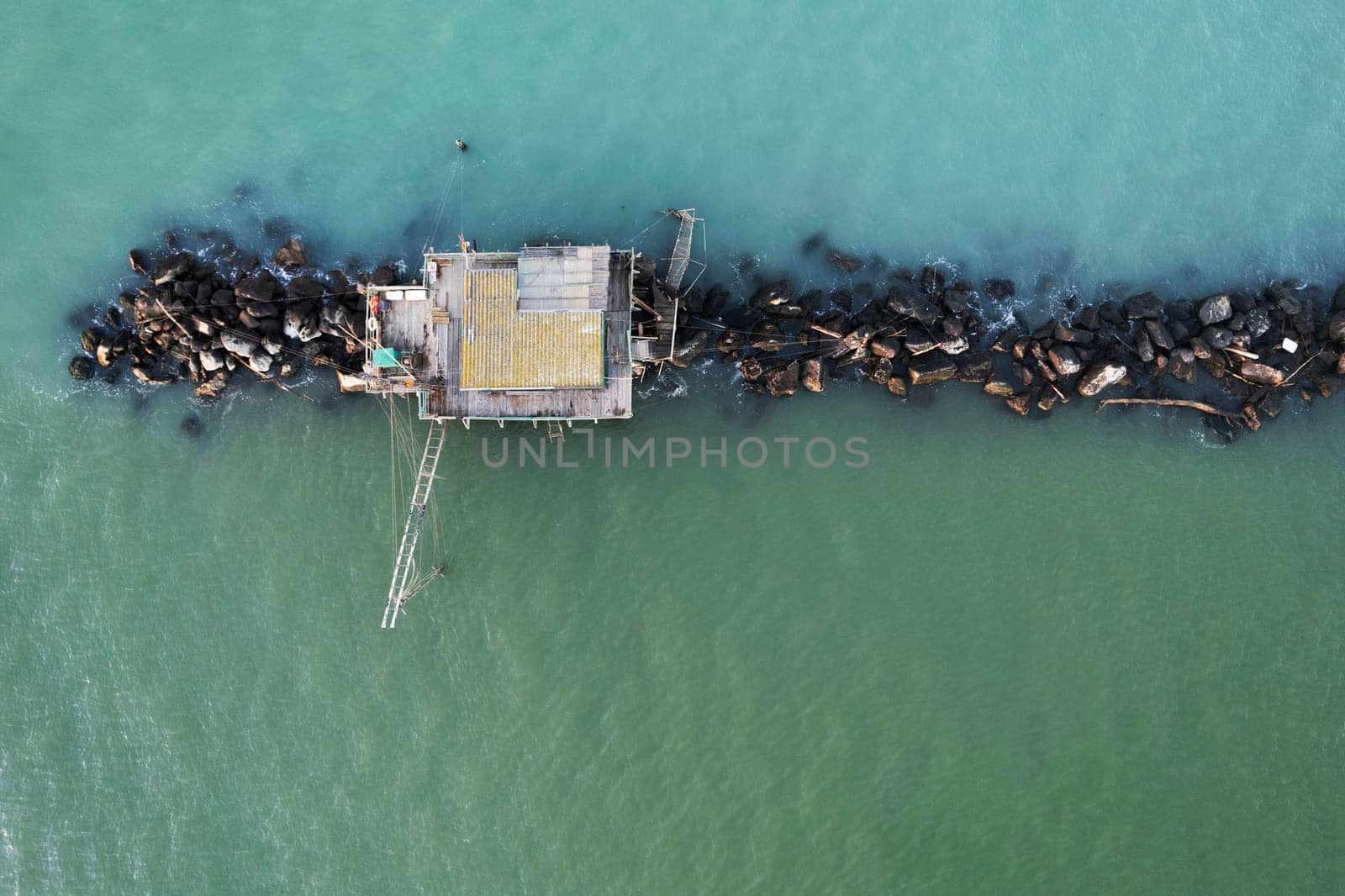 Aerial view of the ancient fishing buildings at the mouth of the Arno River  by fotografiche.eu