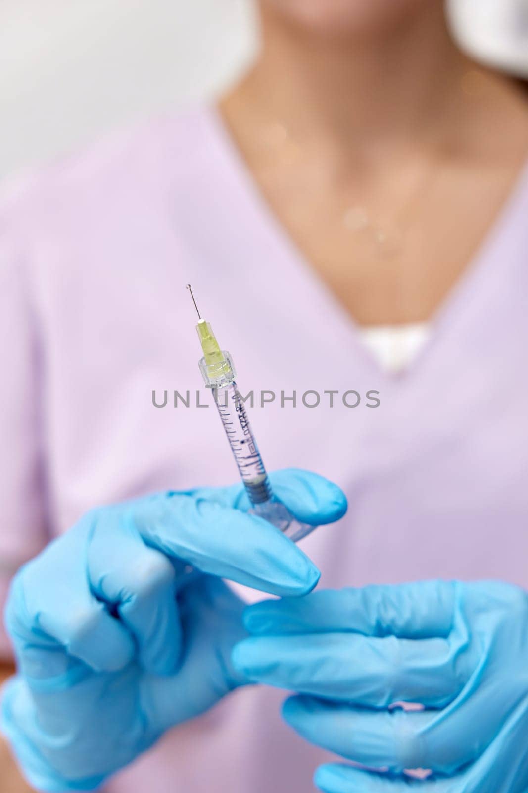Woman holding medical injection syringe in her hand