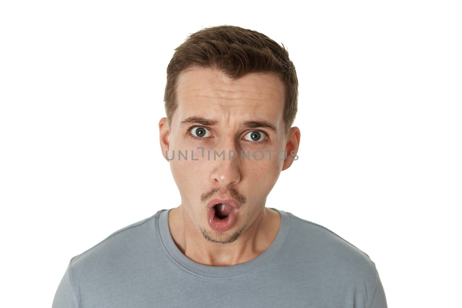 annoyed angry bearded man shouting on white studio background