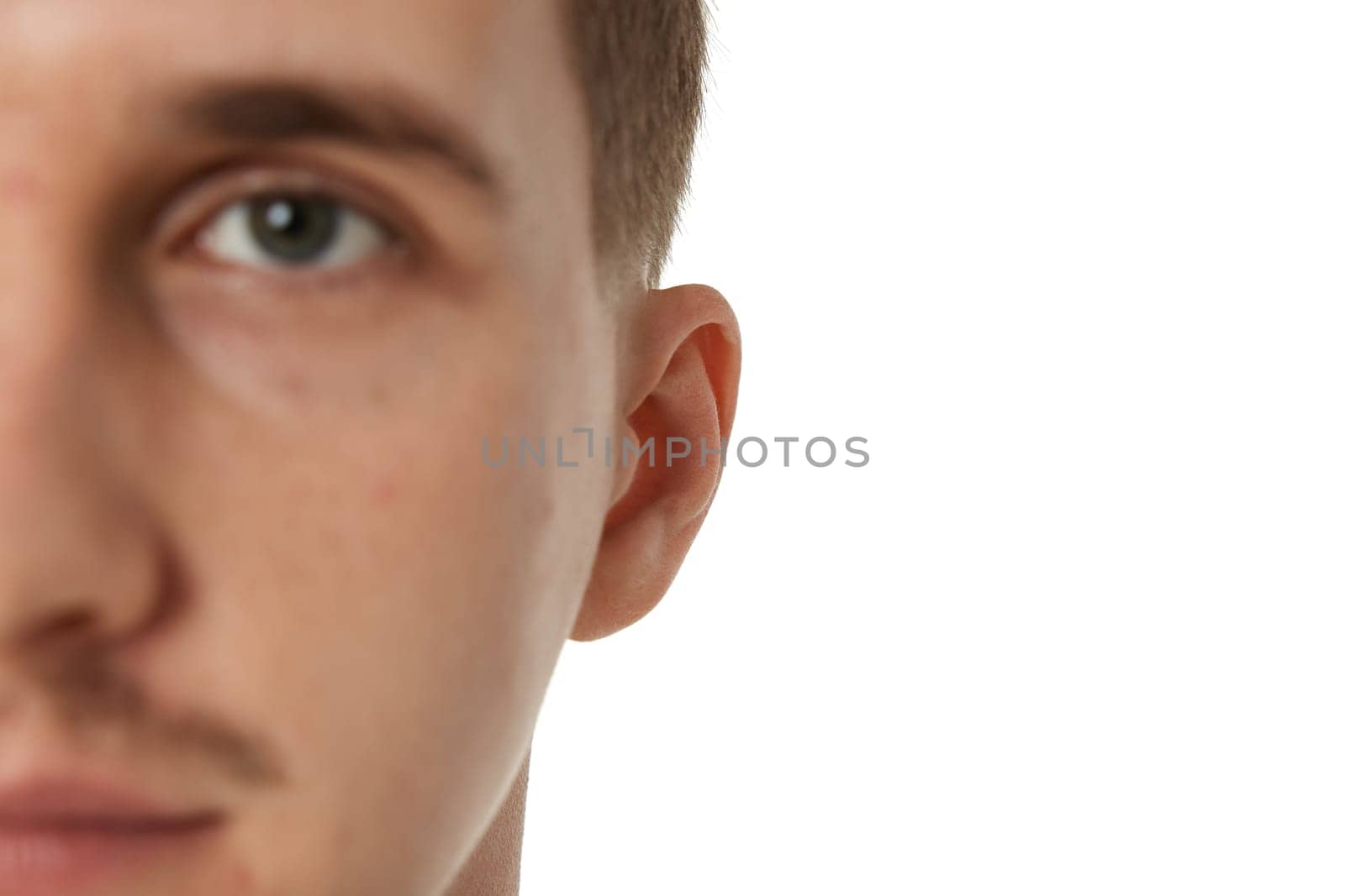 Close up of male ear on white studio background