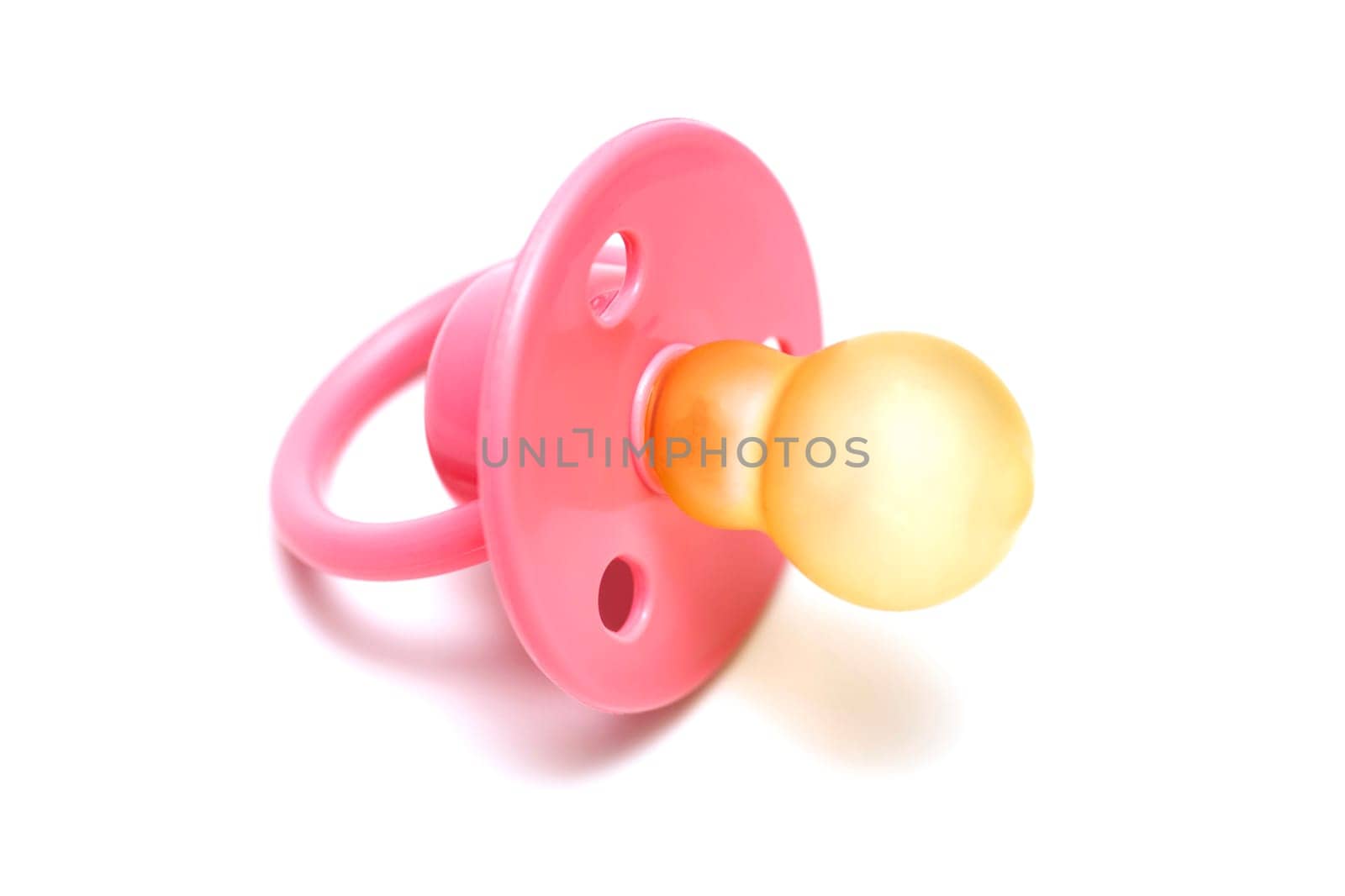 Baby pink mannequin isolated on a white background. Pink babys pacifier isolated on white background.