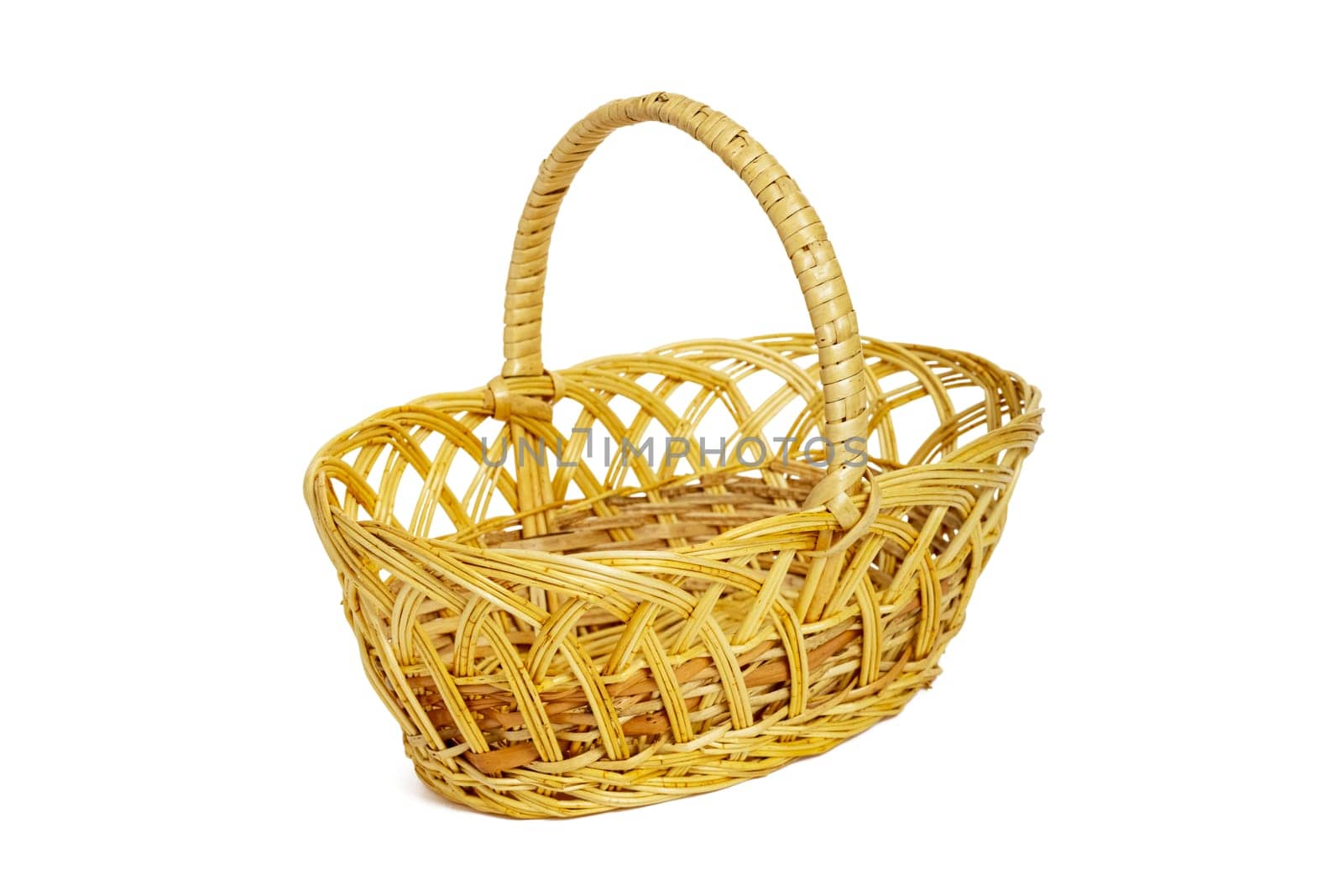 An empty wicker basket isolated on white background. Easter item.