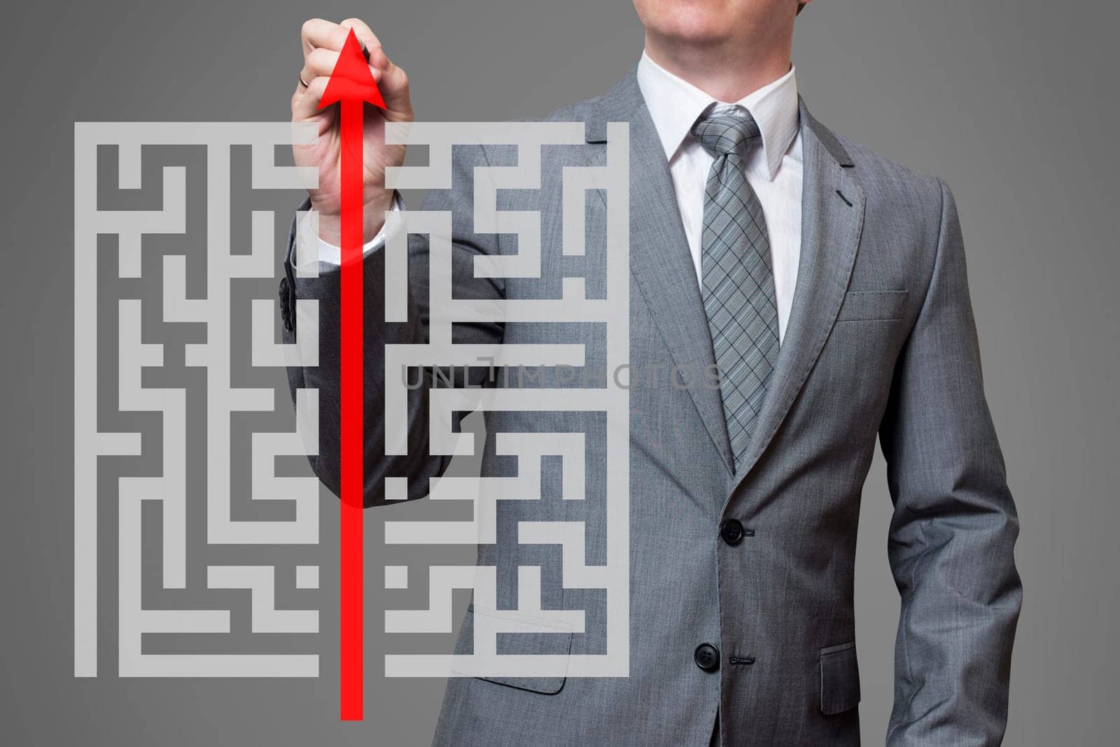 Businessman finding the solution of a maze by andreyz
