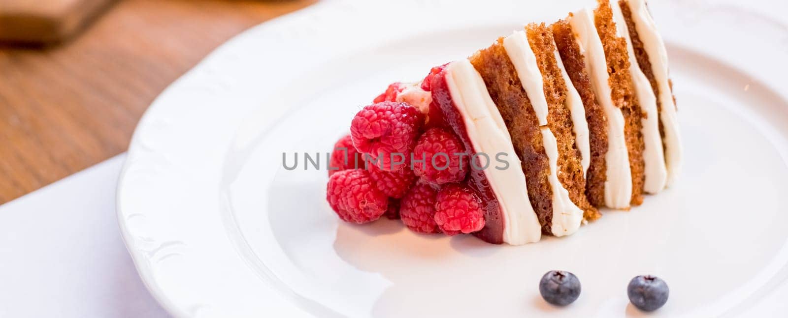 Homemade cheesecake with fresh berries and mint for dessert - healthy organic summer dessert pie cheesecake. Banner.