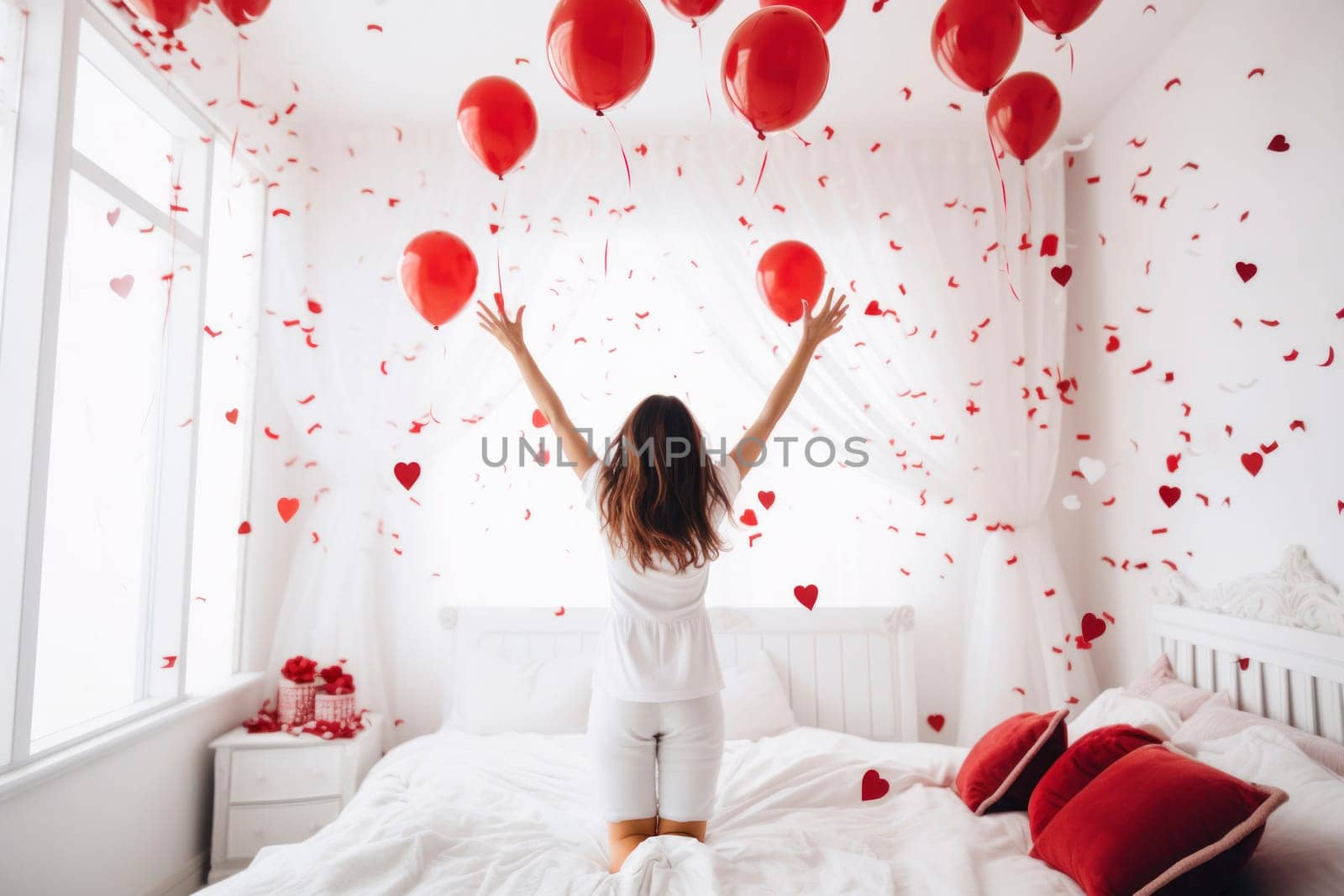 A happy woman in a bedroom experiences joy as heart-shaped confetti falls on her, creating a romantic and festive celebration