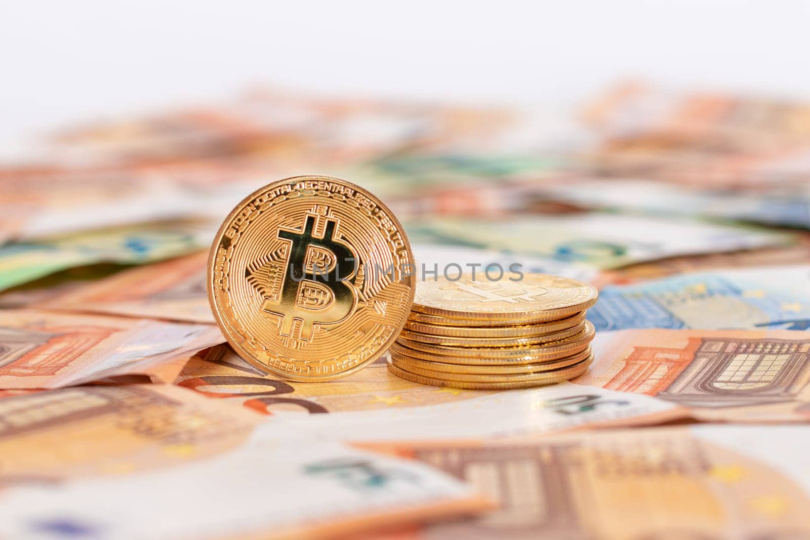 A Stack of Bitcoin Coins Visible Through a Magnifying Glass on the 50-Euro Banknotes by InfinitumProdux