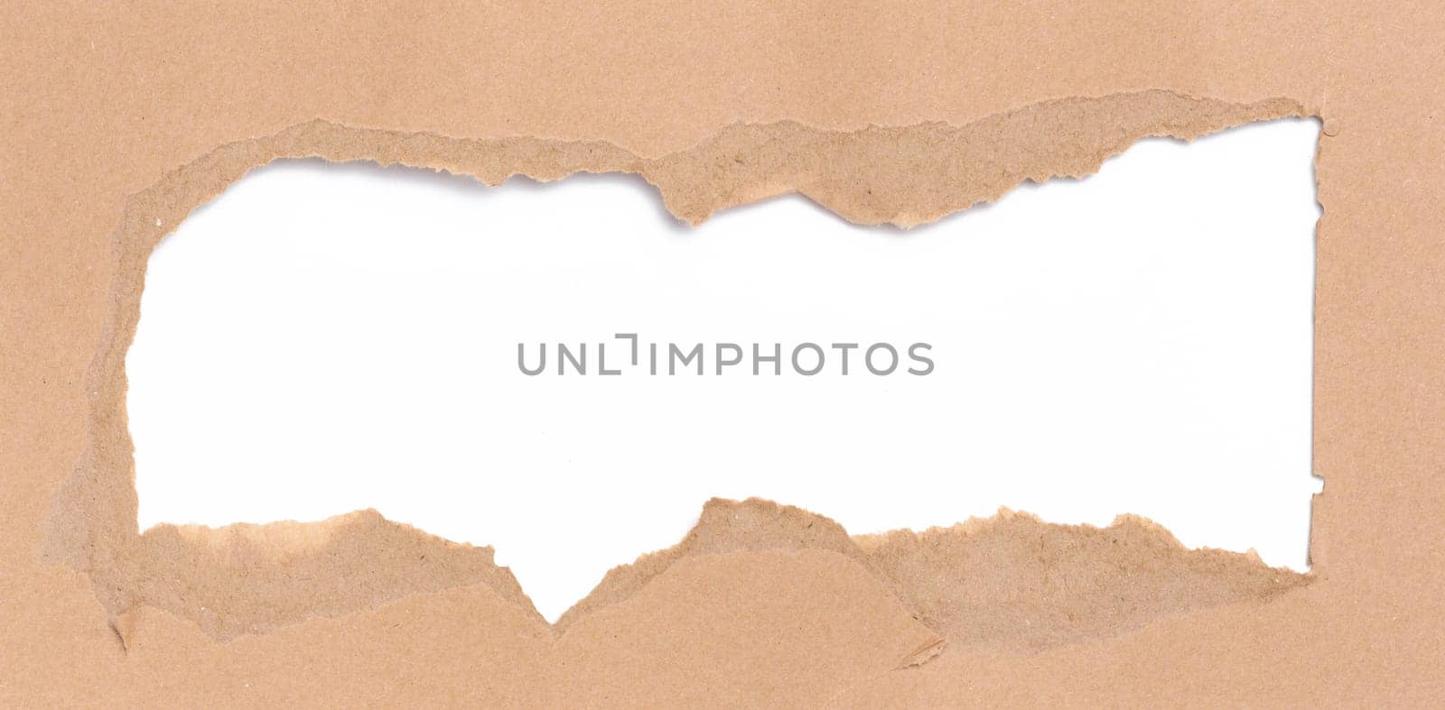Torn edges of brown paper on a white background, space for writing