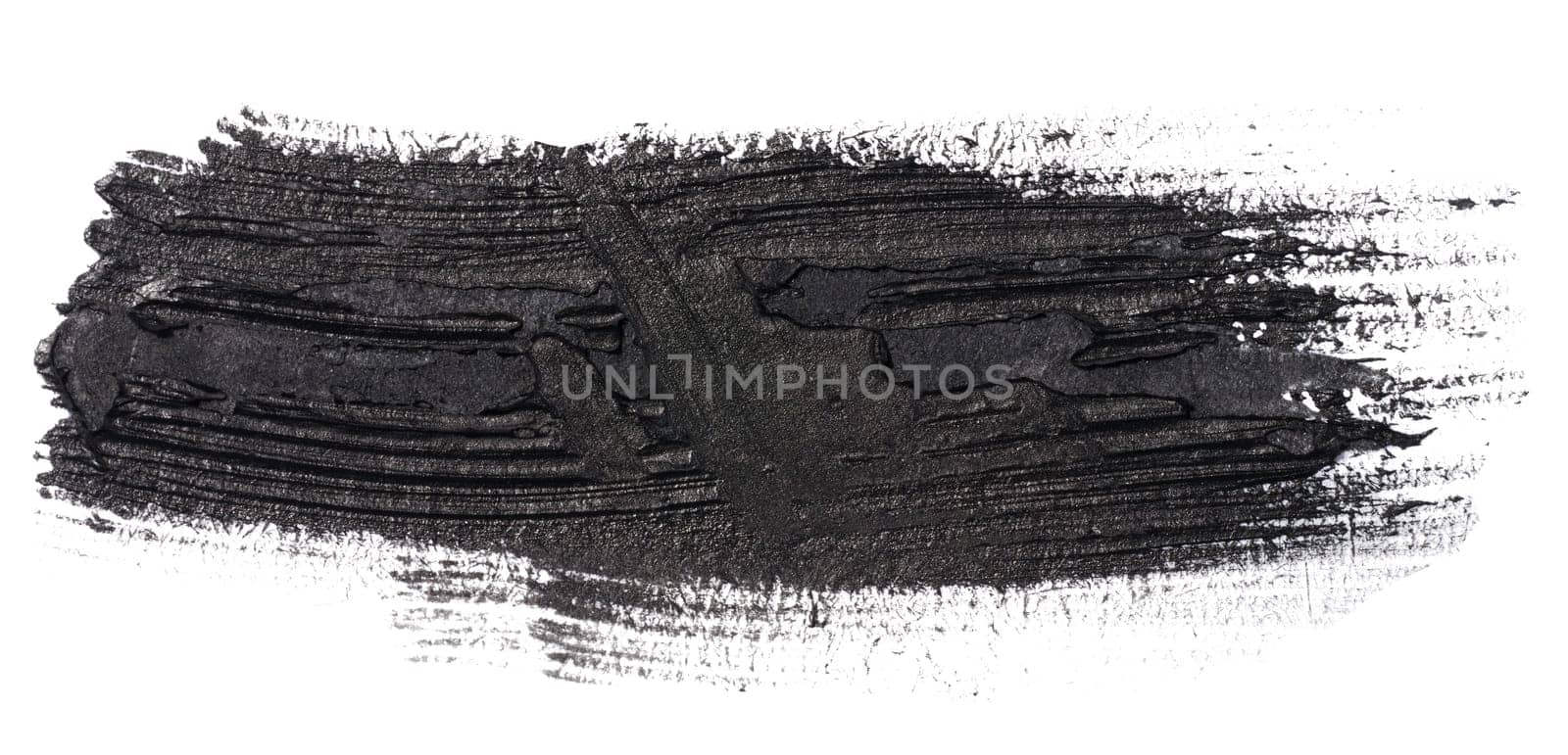 Swatch of black smudged acrylic paint isolated on white background, close up by ndanko