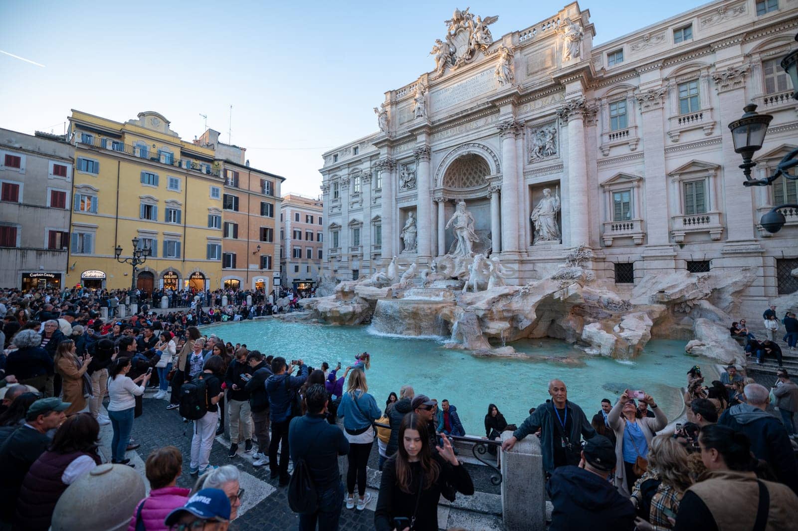 Tourists at the Trevi Fountain, the historic center of the city of Rome in Italy in 2023. by martinscphoto