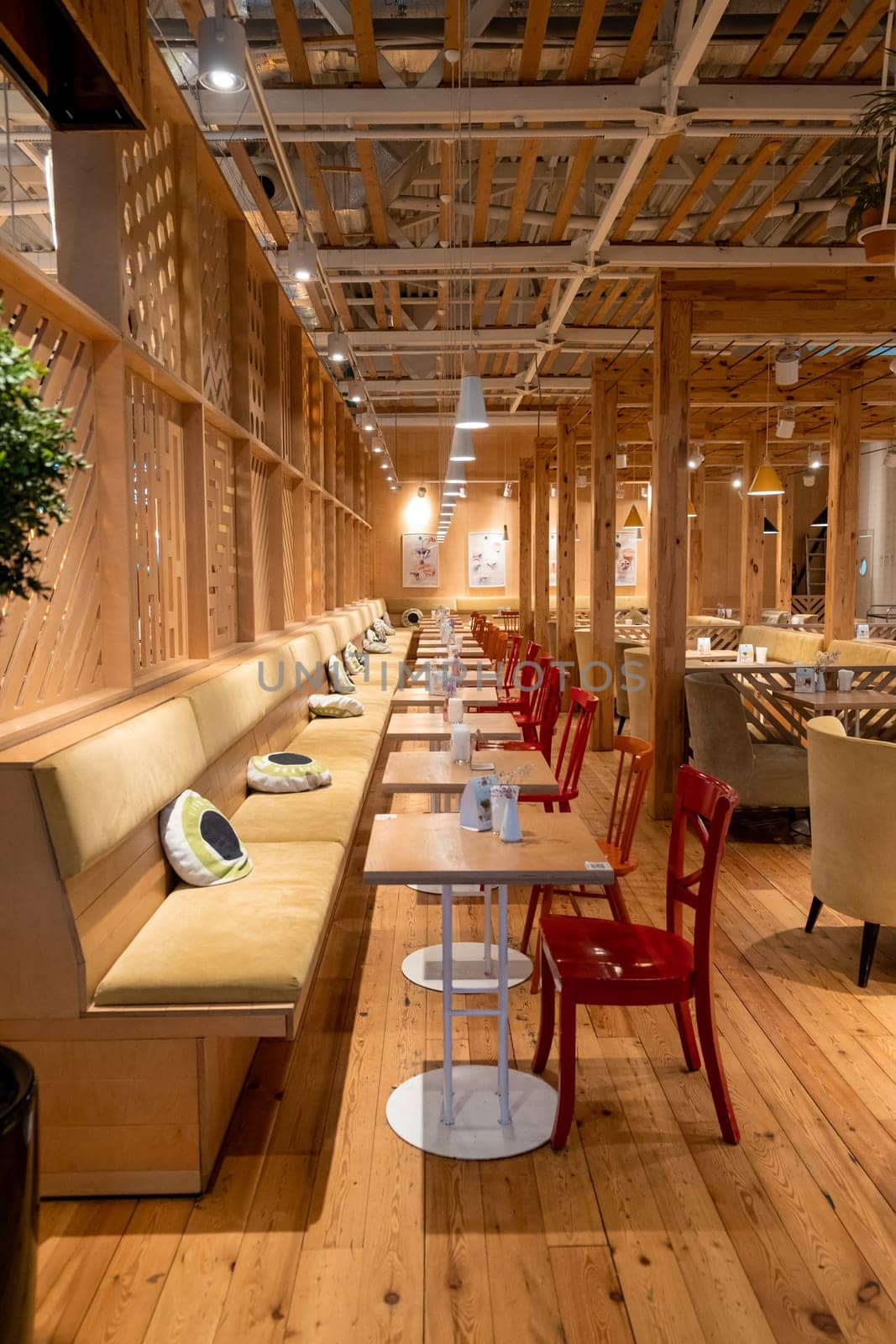 Loft style restaurant with textured wooden walls. Cafe in wooden style by AnatoliiFoto