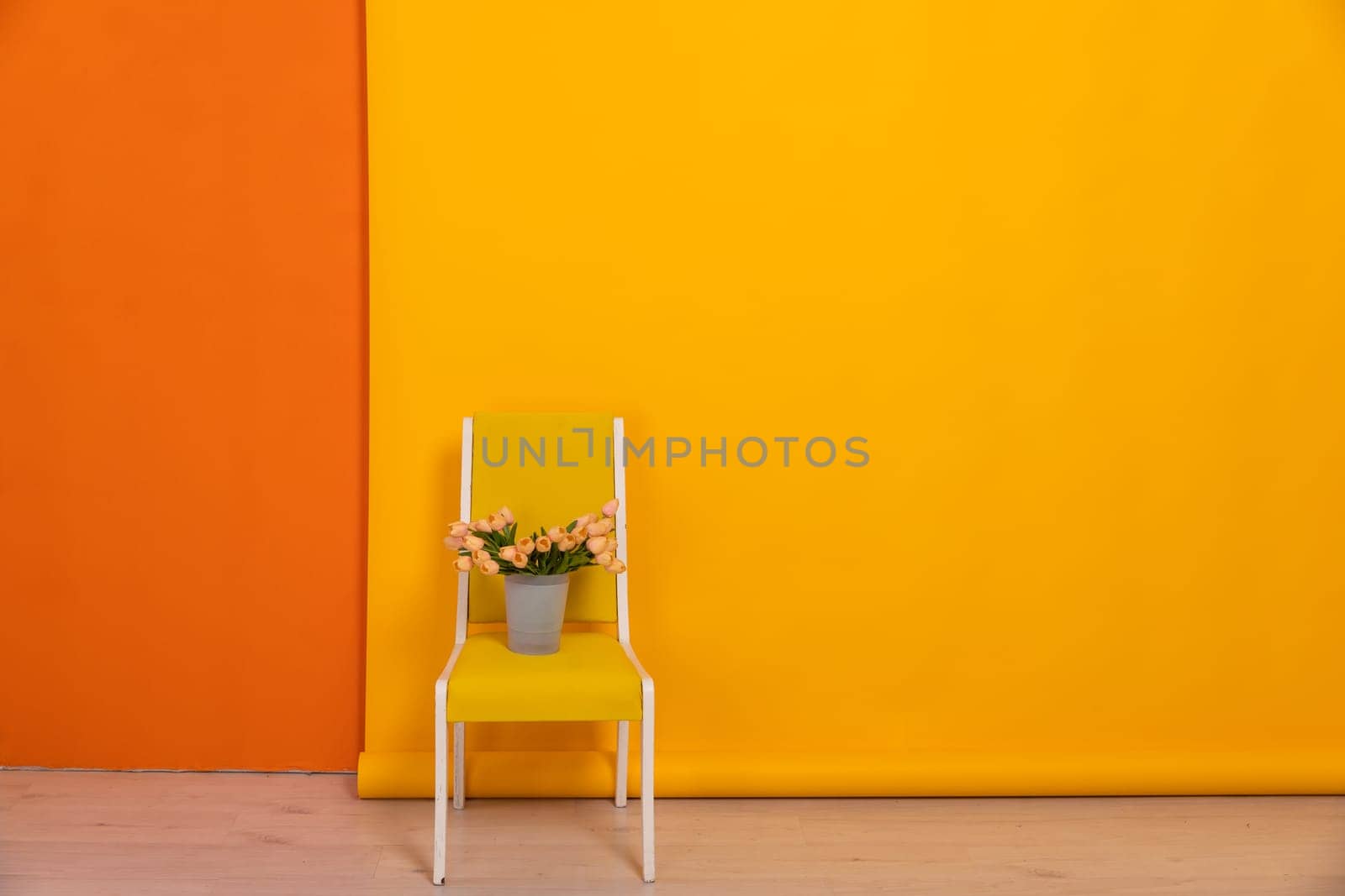 One yellow chair in orange wall interior by Simakov