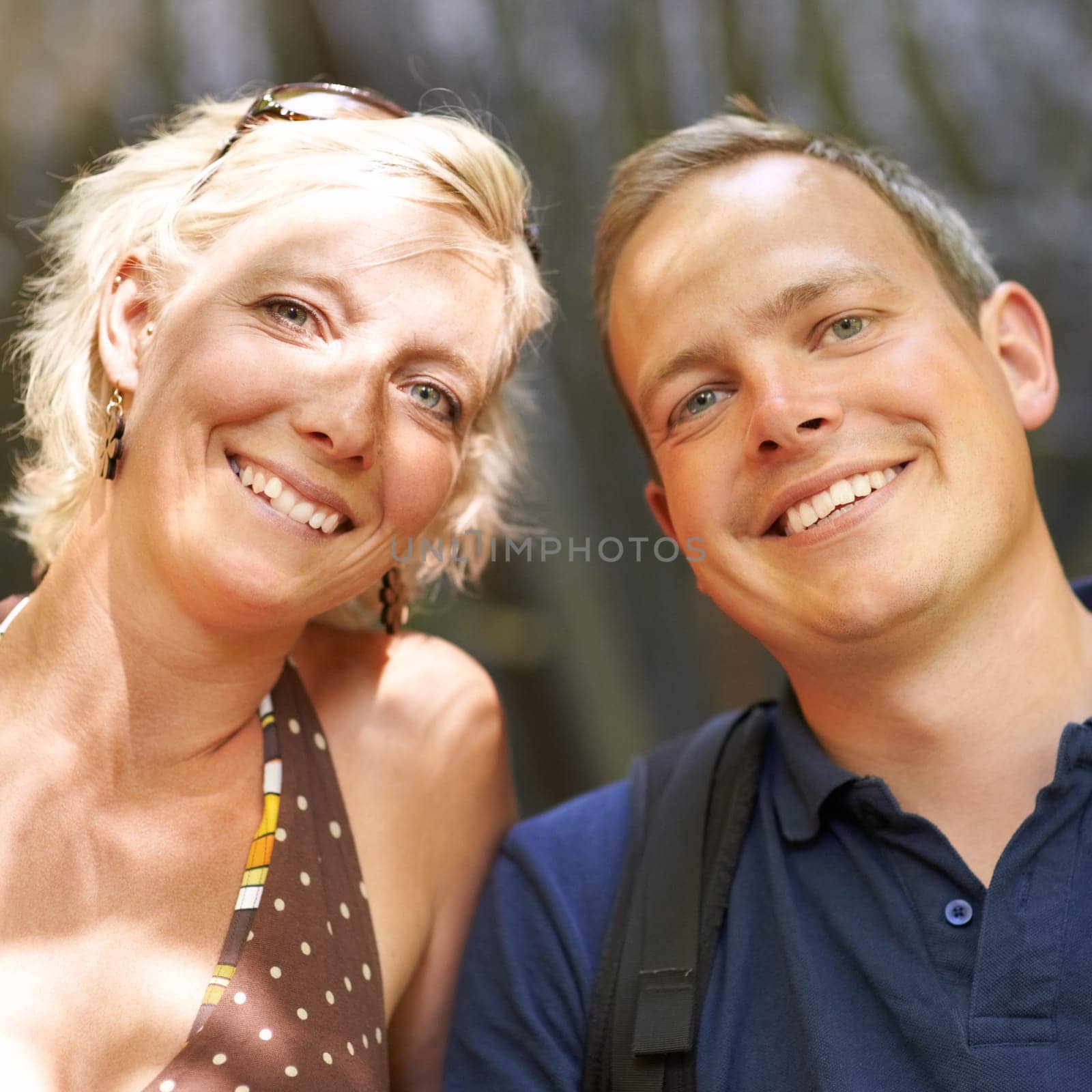 Smile, portrait and couple together outdoor, healthy relationship or connection in summer freedom. Face, happy man and woman or romantic people bonding, support and trust on date, vacation or holiday by YuriArcurs