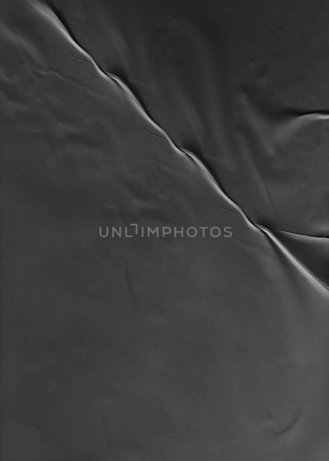 Background image of vertical thin black paper with crumpled surface