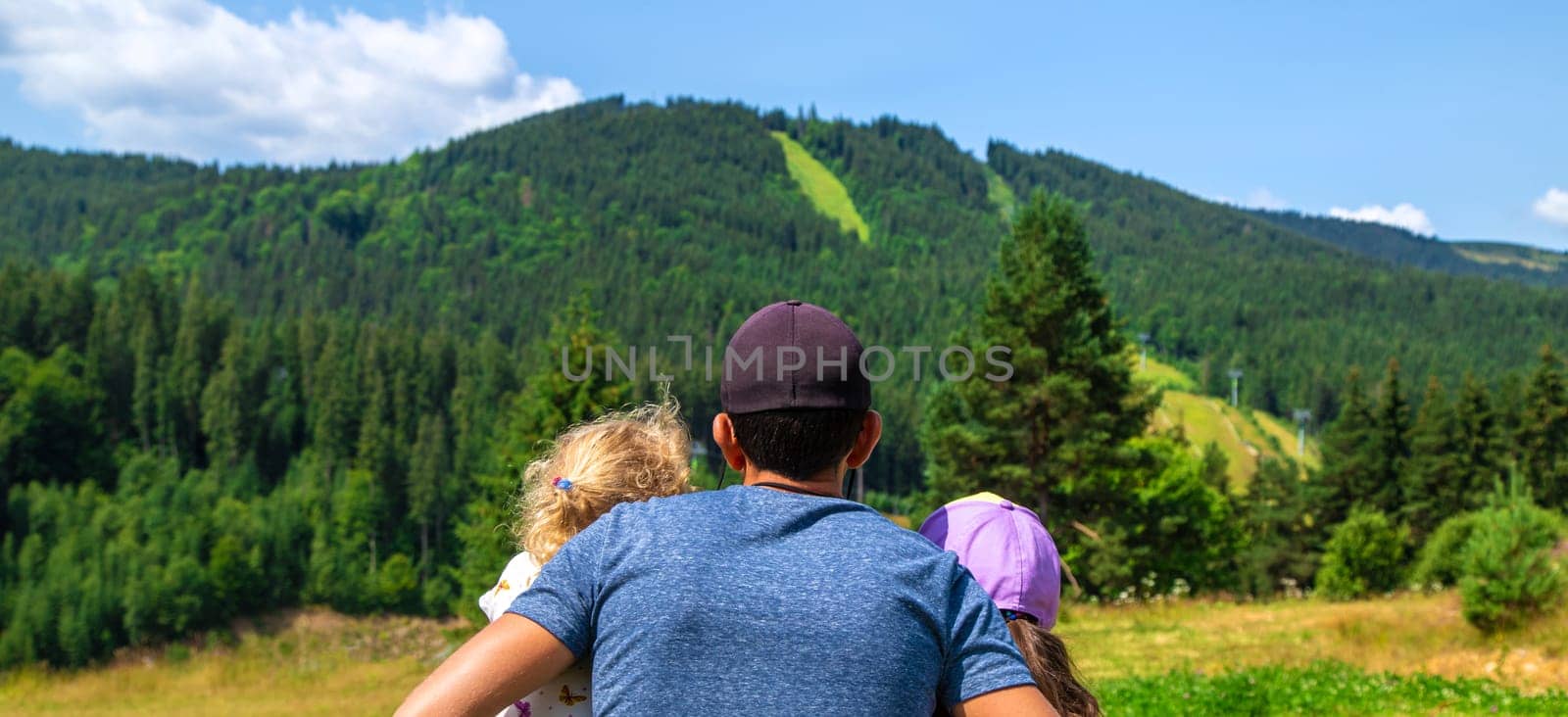 Family in the mountains tourists. Selective focus. by yanadjana