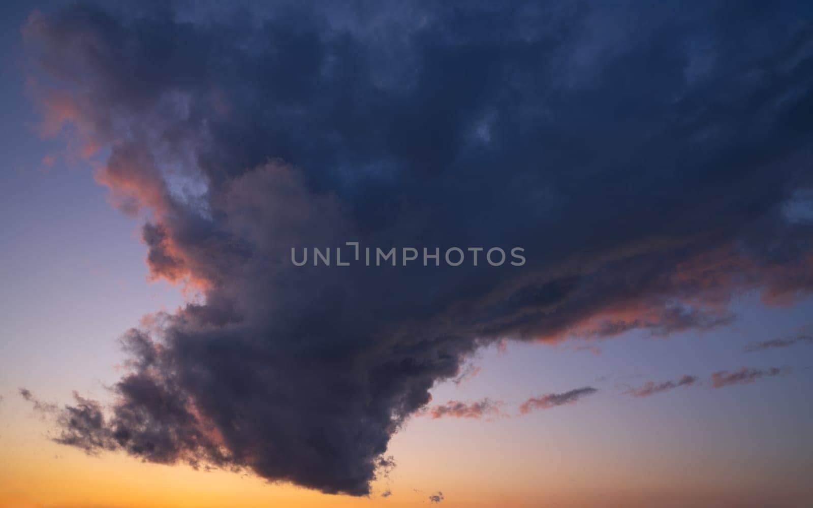 Low angle view to evening sky with dramatic clouds