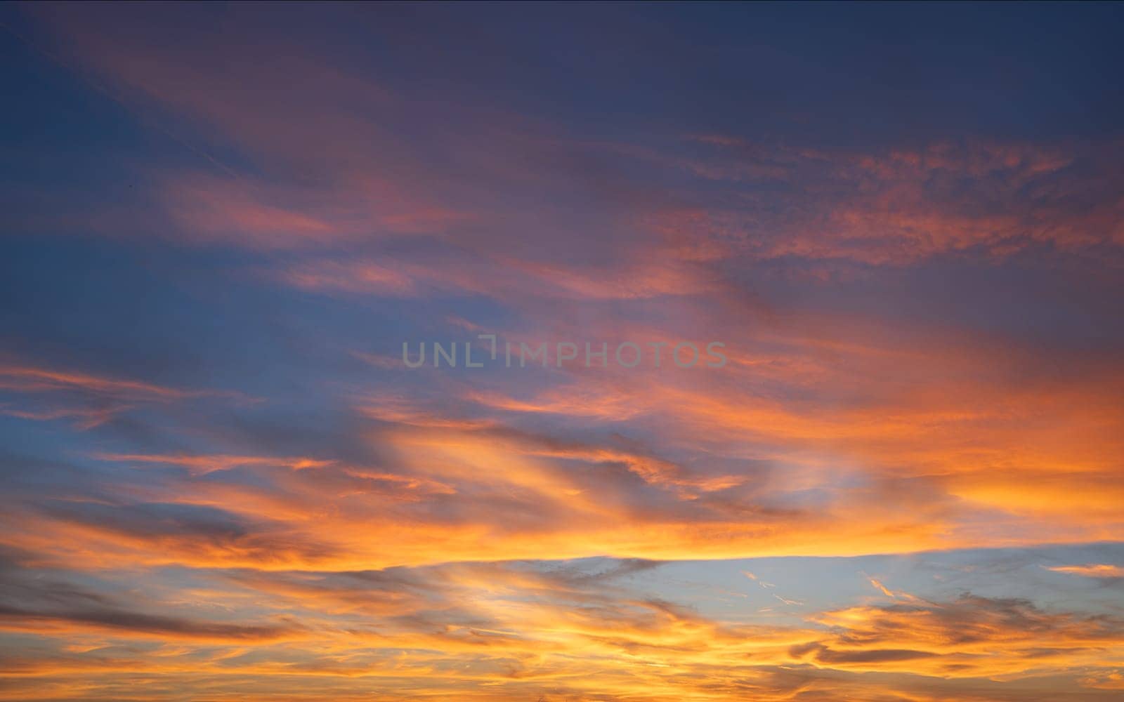 Low angle view to evening sky with dramatic clouds