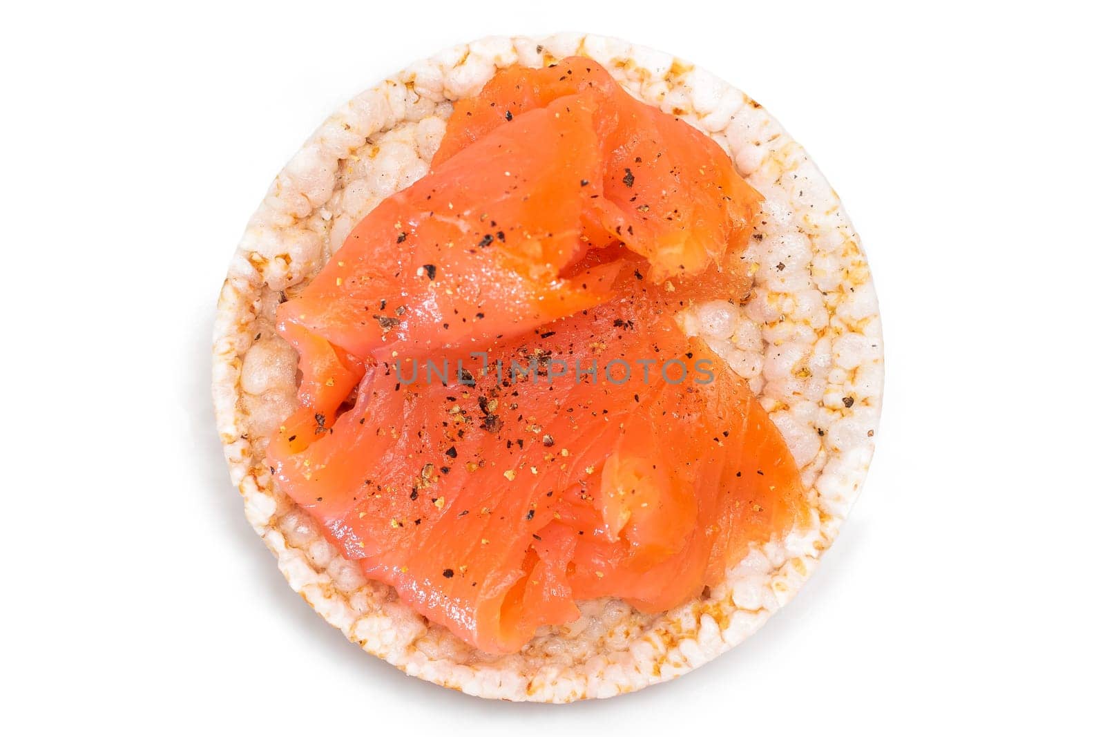 Rice Cake Sandwich with Fresh Salmon Slices Isolated on White by InfinitumProdux