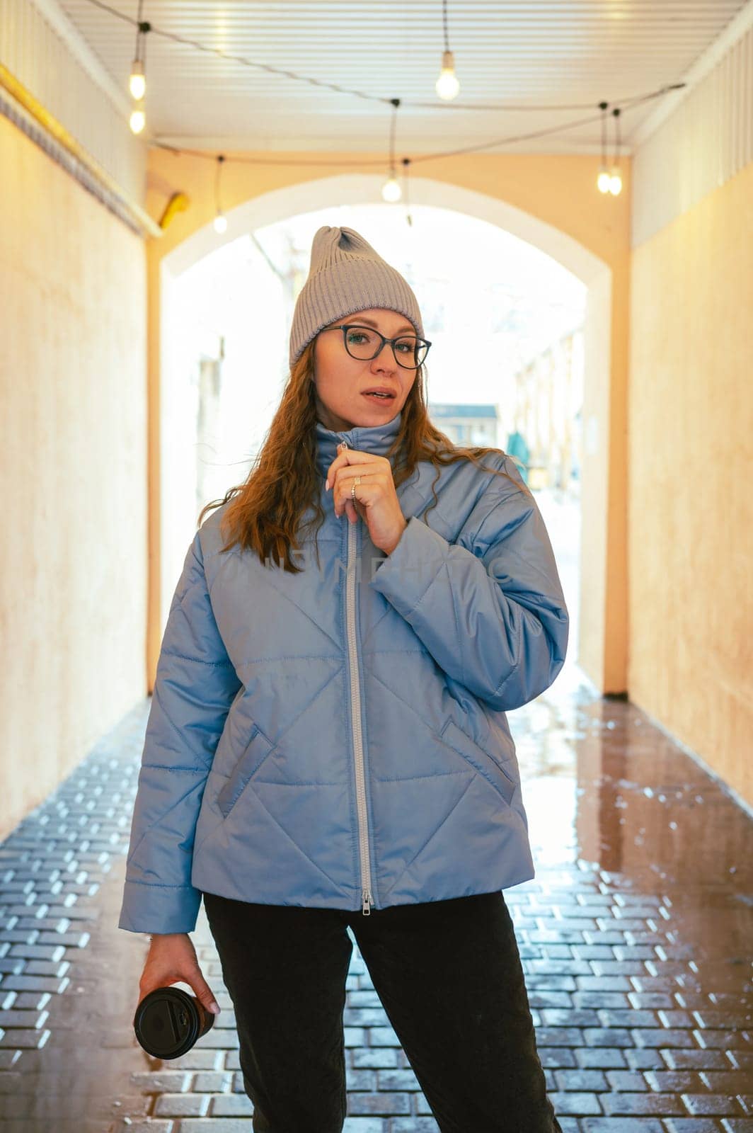 Portrait of a stylish woman in blue jacket. Spring outdoor portrait.