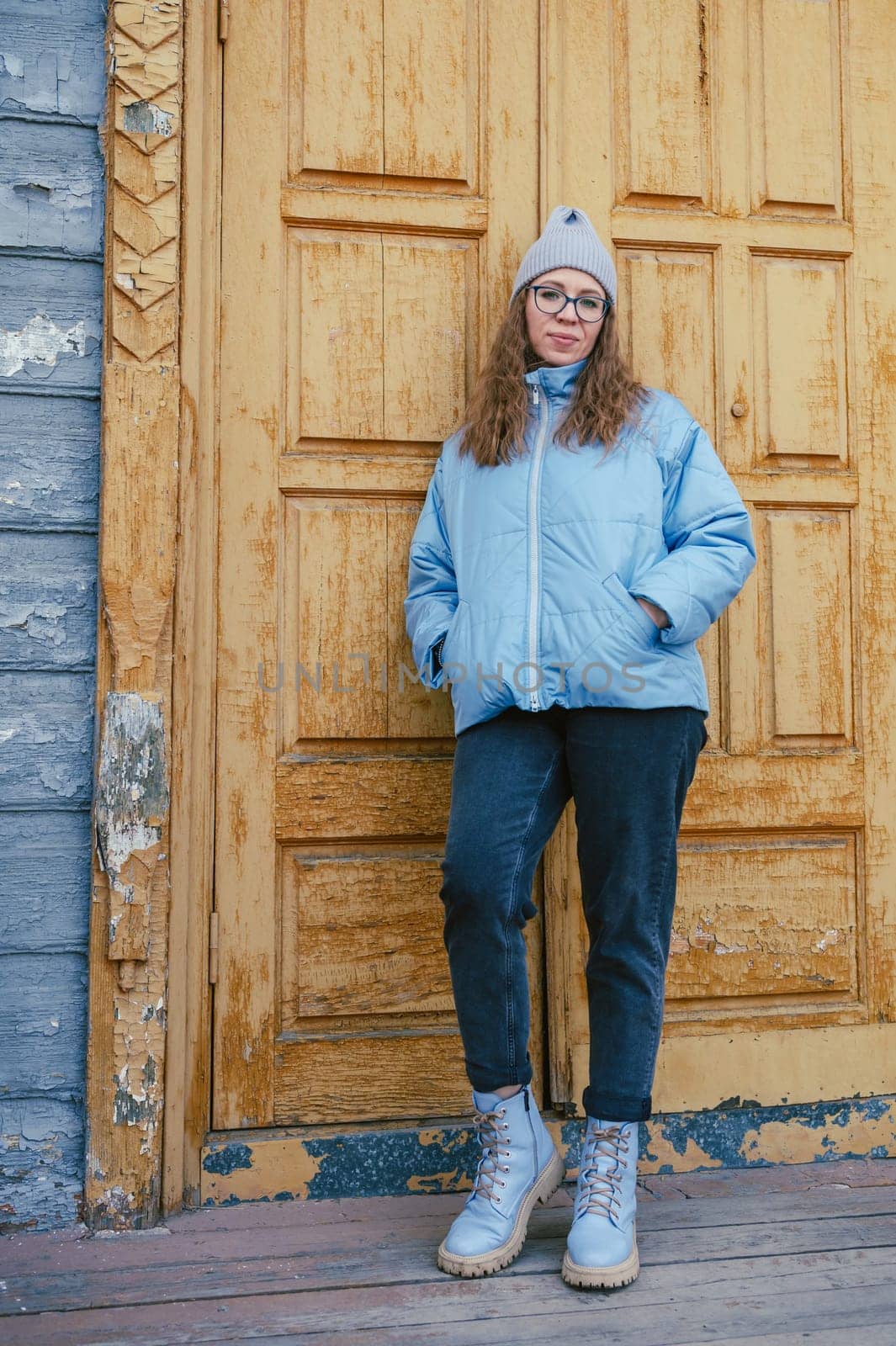 Portrait of a stylish woman in blue jacket. Spring outdoor portrait.