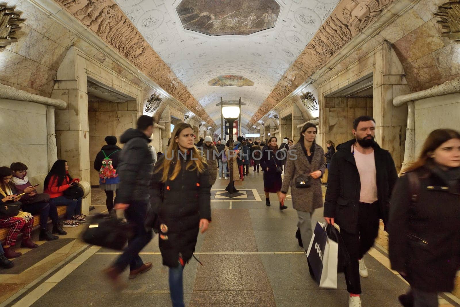 Moscow, Russia - FEB 20. 2020. Many passengers at Novokuznetskaya metro station by olgavolodina