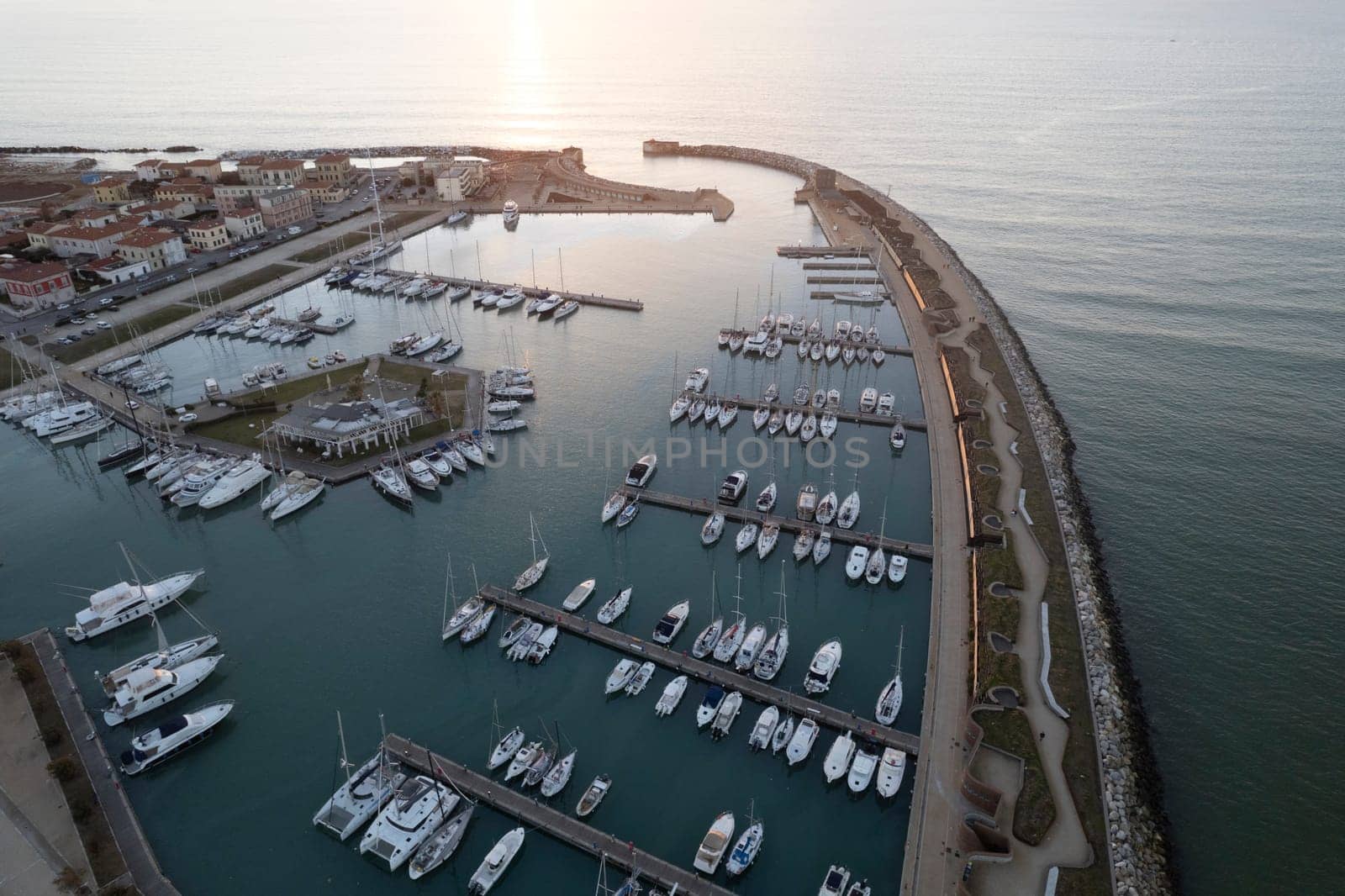 Aerial photographic documentation of the port of Marina di Pisa at sunset 