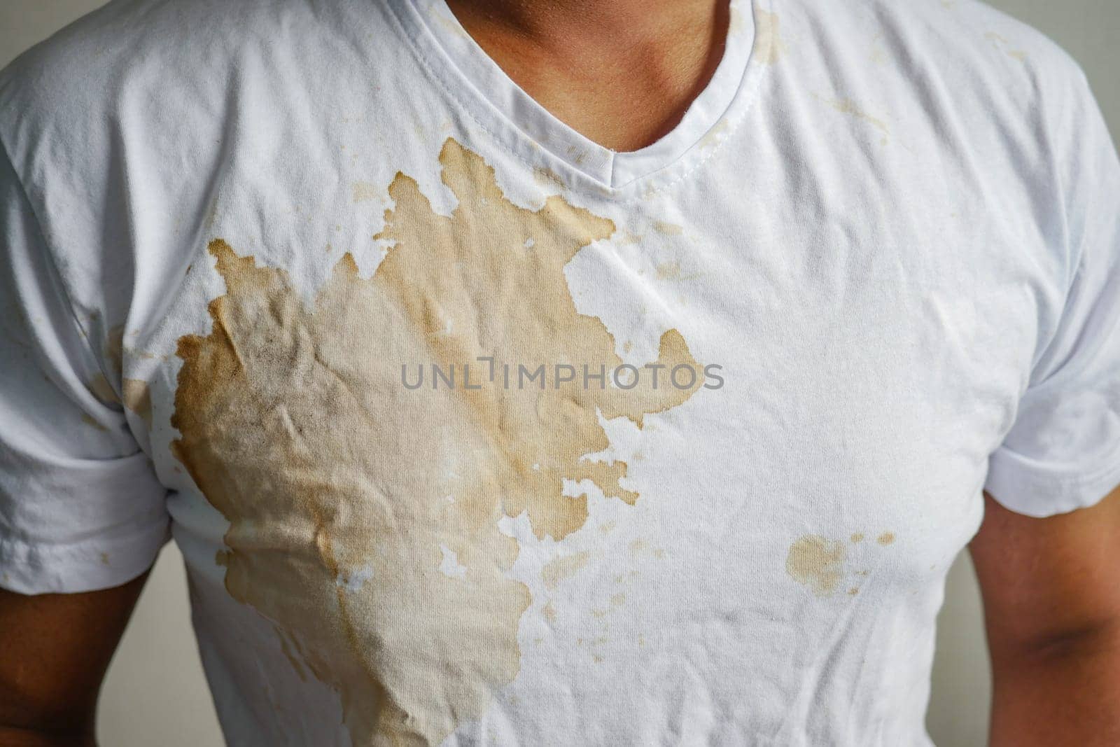 young men with White fabric with coffee stain and wrinkles