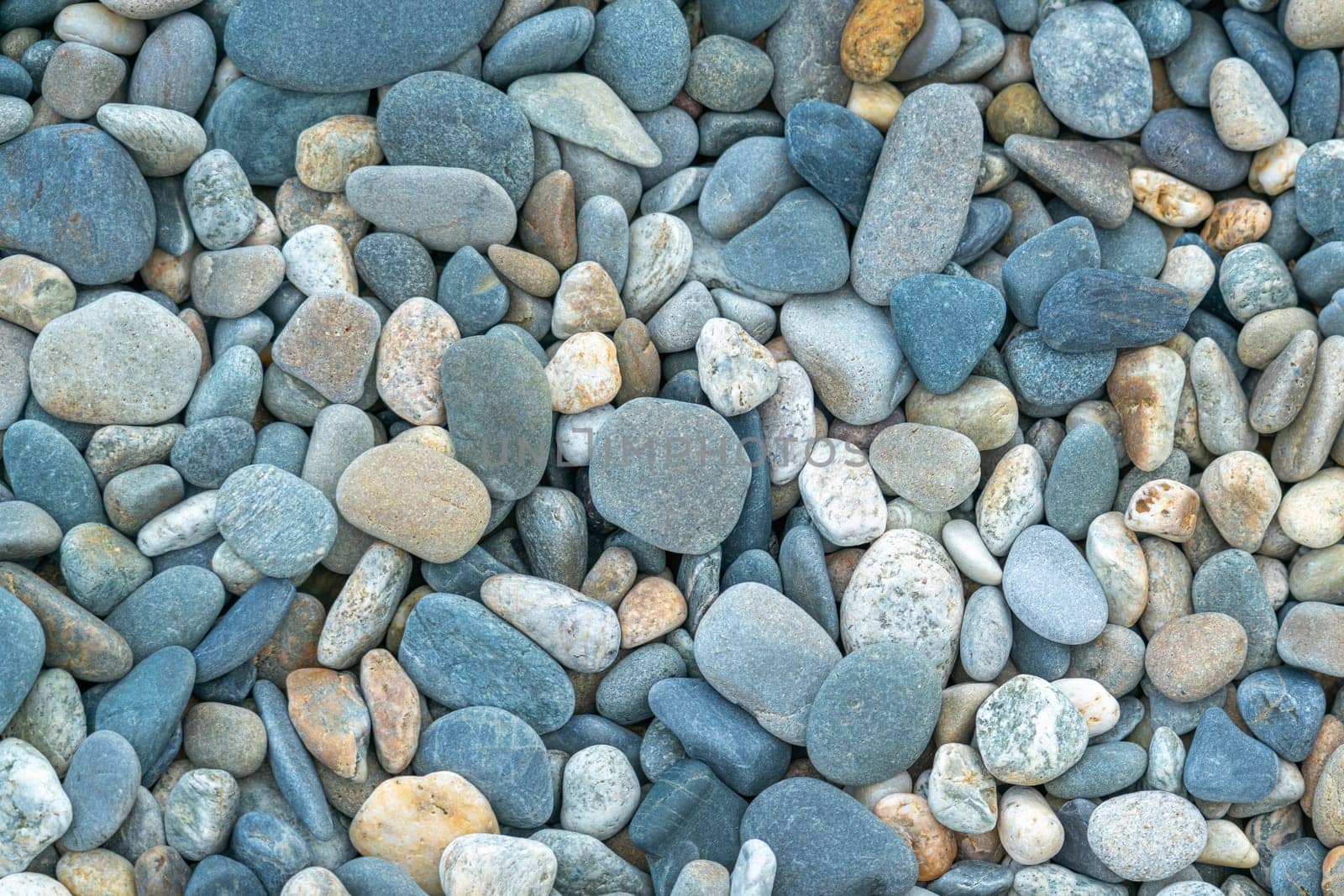 the texture of the pebbles in close-up as a background by roman112007