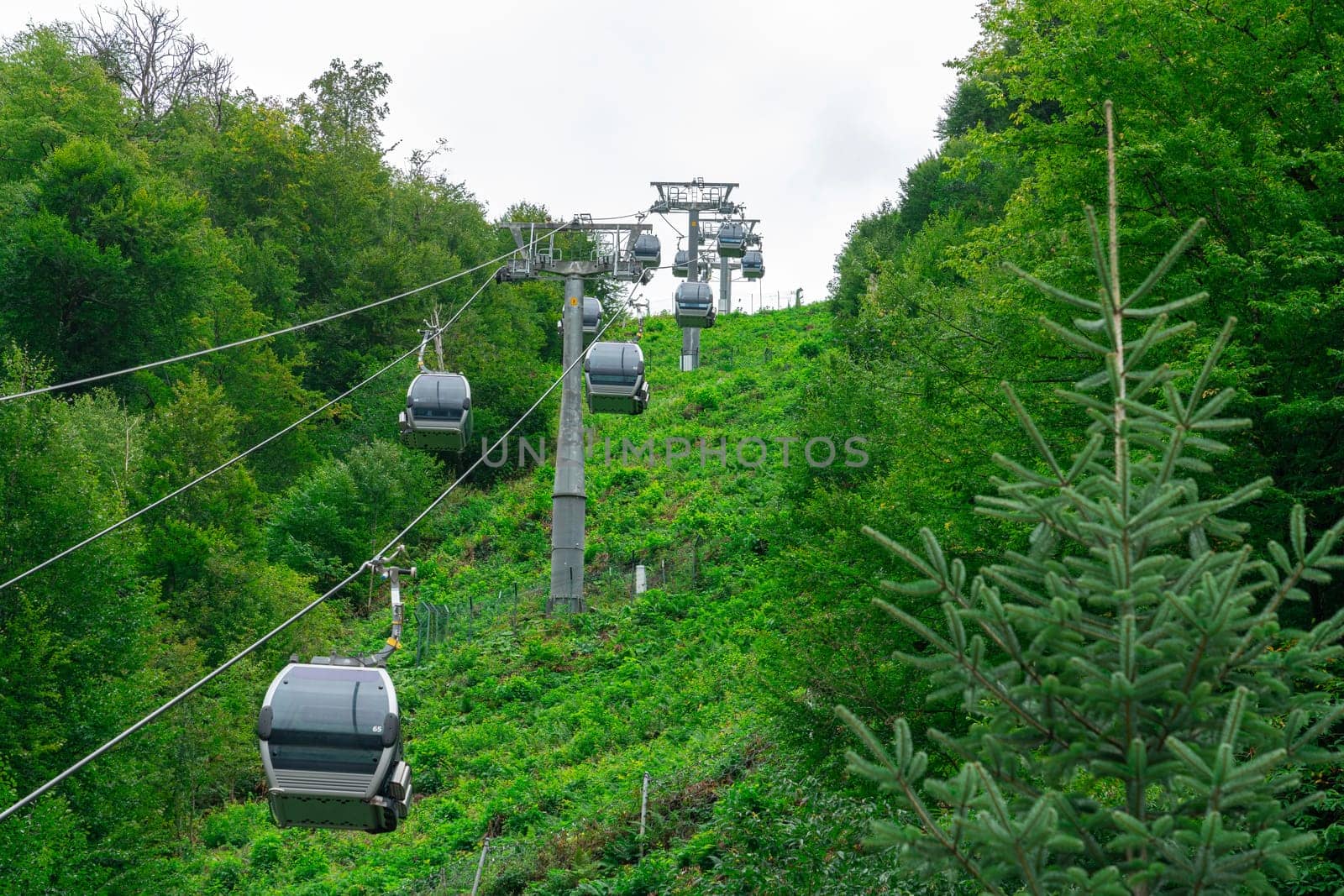 lifts of the mountain cable car on the background of mountains by roman112007