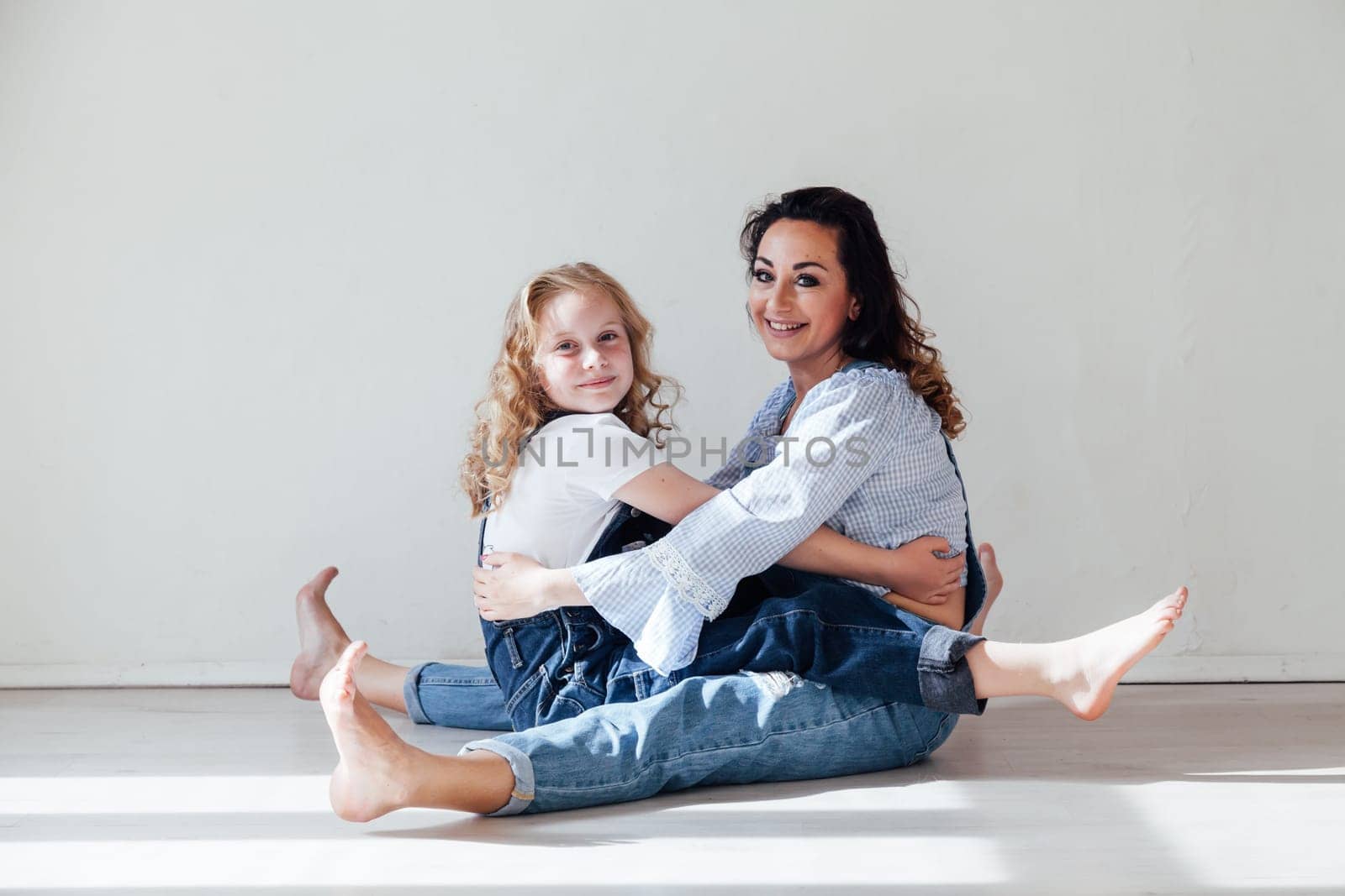 Portrait of a fashionable mom and daughter's family love