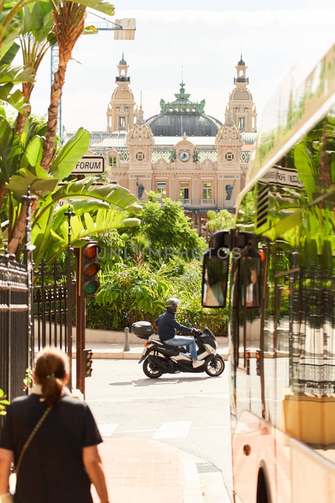 Monaco, Monte-Carlo, 21 October 2022 - Square Casino Monte-Carlo at sunny day, wealth life, tourists take pictures of the landmark, pine trees, blue sky. High quality photo