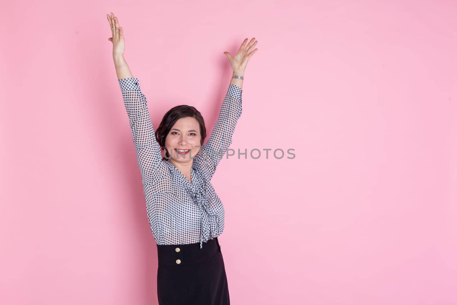 beautiful Asian woman on a pink background