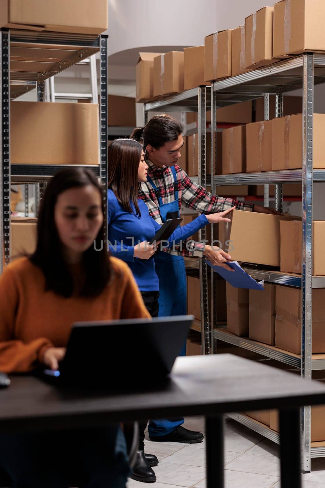 Postal storehouse employees managing order picking and shipping operation by DCStudio