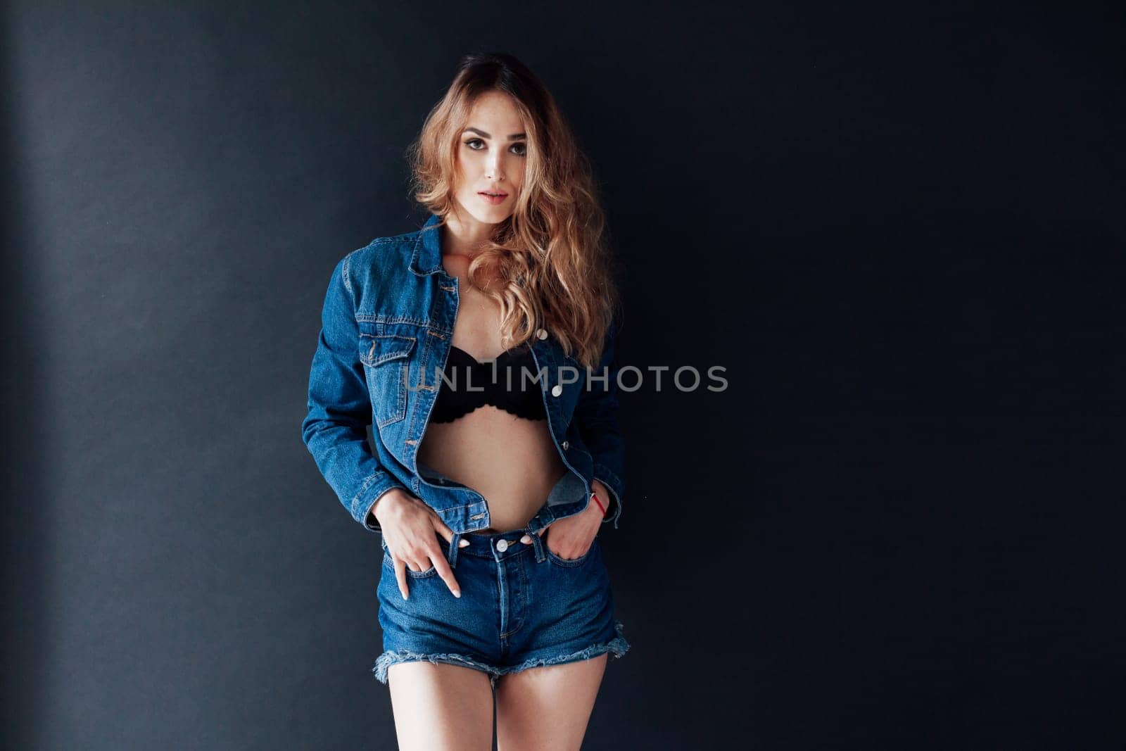 Portrait of a fashionable woman in lingerie and jeans