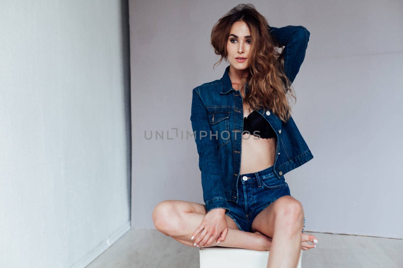 Portrait of a fashionable woman in lingerie and jeans