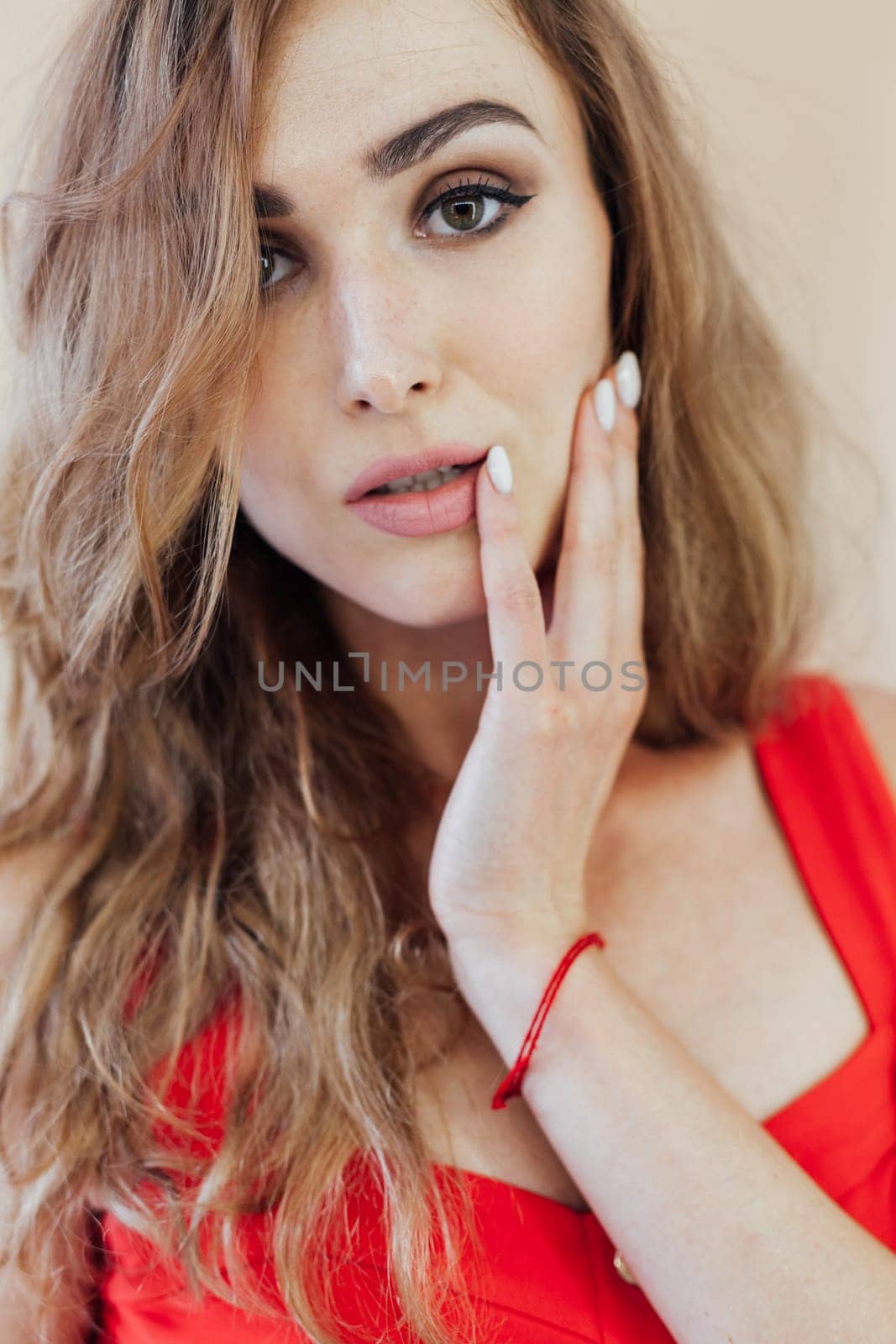 Portrait of a beautiful woman in a red dress