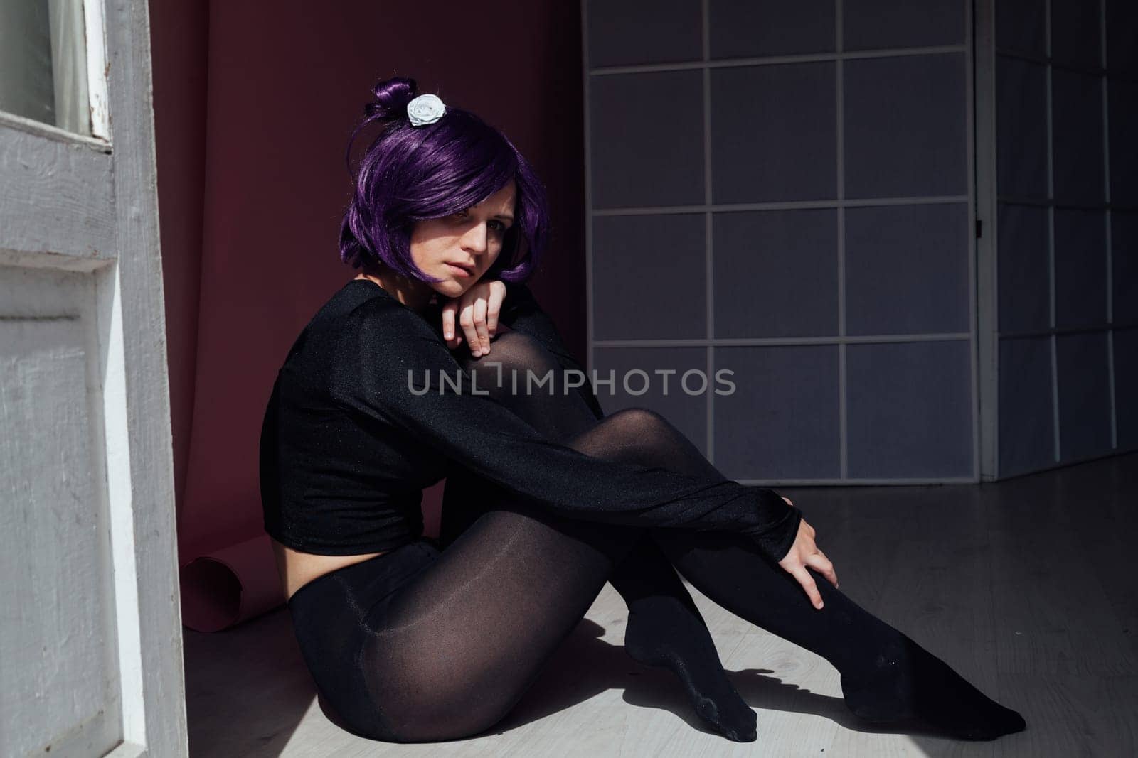 Woman anime cosplayer with purple hair Japan