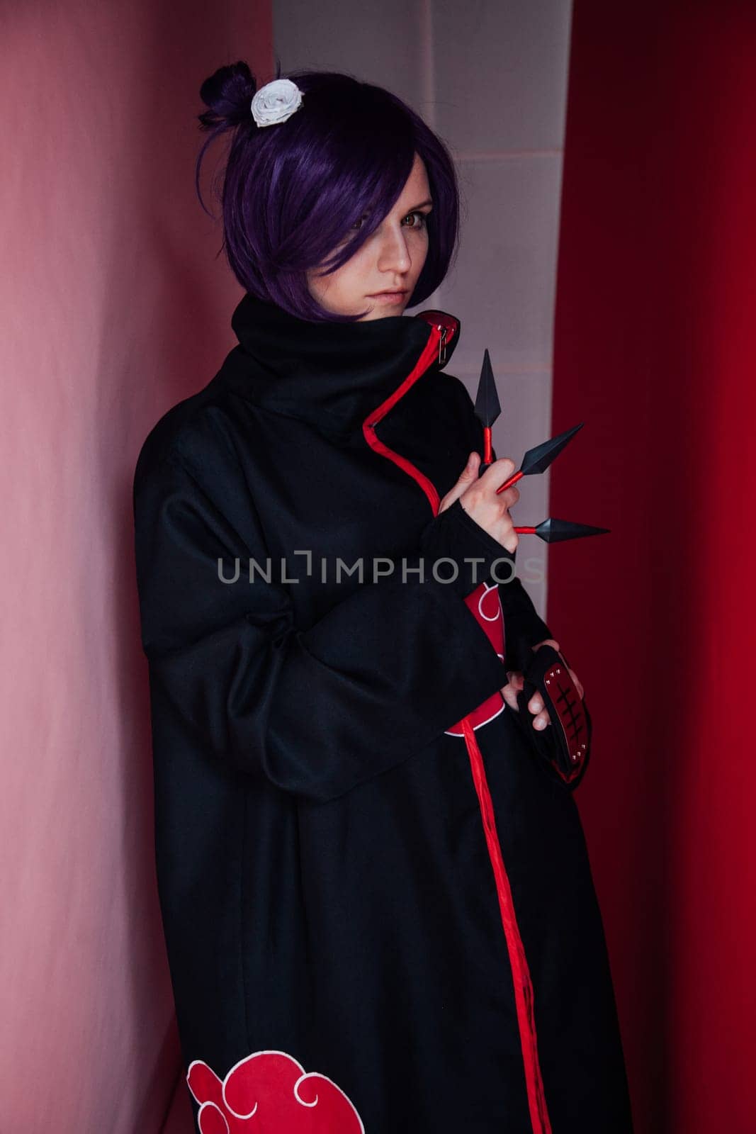 woman anime cosplayer with purple hair