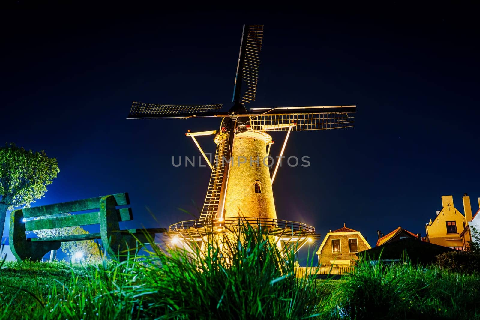 Night View of an Old Windmill with Lights in Zierikzee, Netherlands by PhotoTime