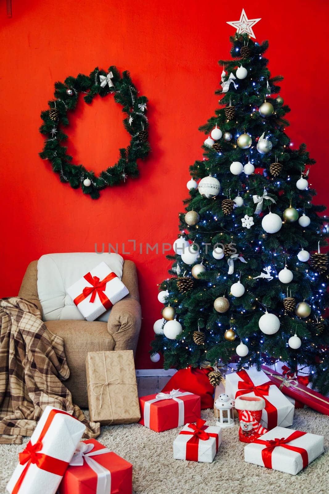 Christmas tree with gifts in the interior of the red room decor for the new year