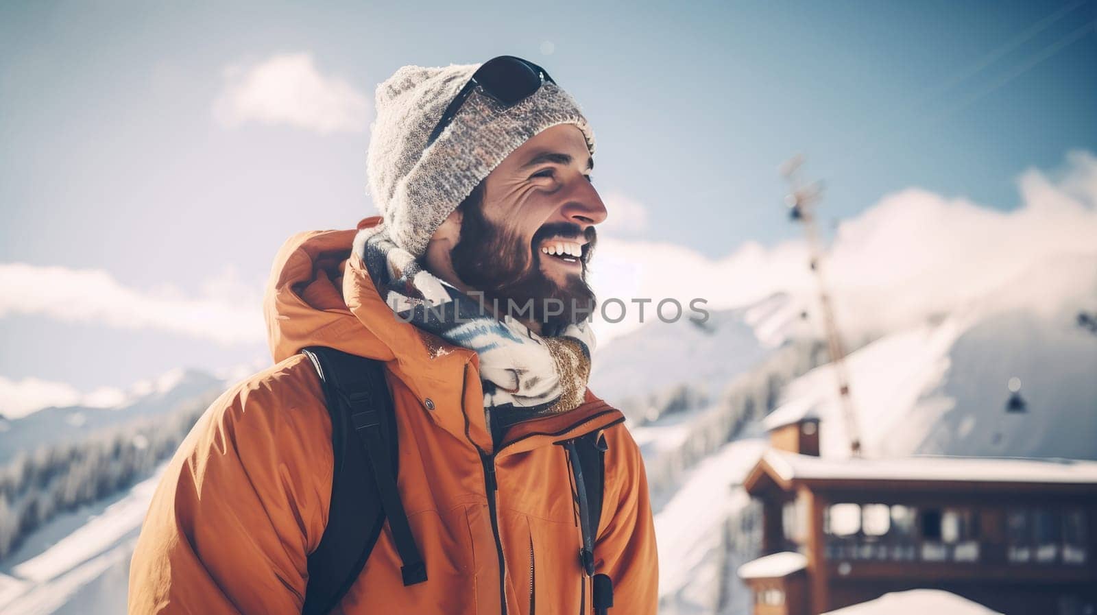 Happy, smiling, Caucasian man against the backdrop of snowy mountains at a ski resort, during vacation and winter holidays. by Alla_Yurtayeva