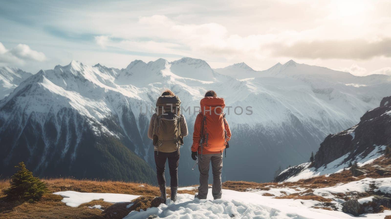 Happy, young loving couple high on snowy mountains at a ski resort, during vacation and winter holidays. Concept of traveling around the world, recreation, winter sports, vacations, tourism in the mountains and unusual places.