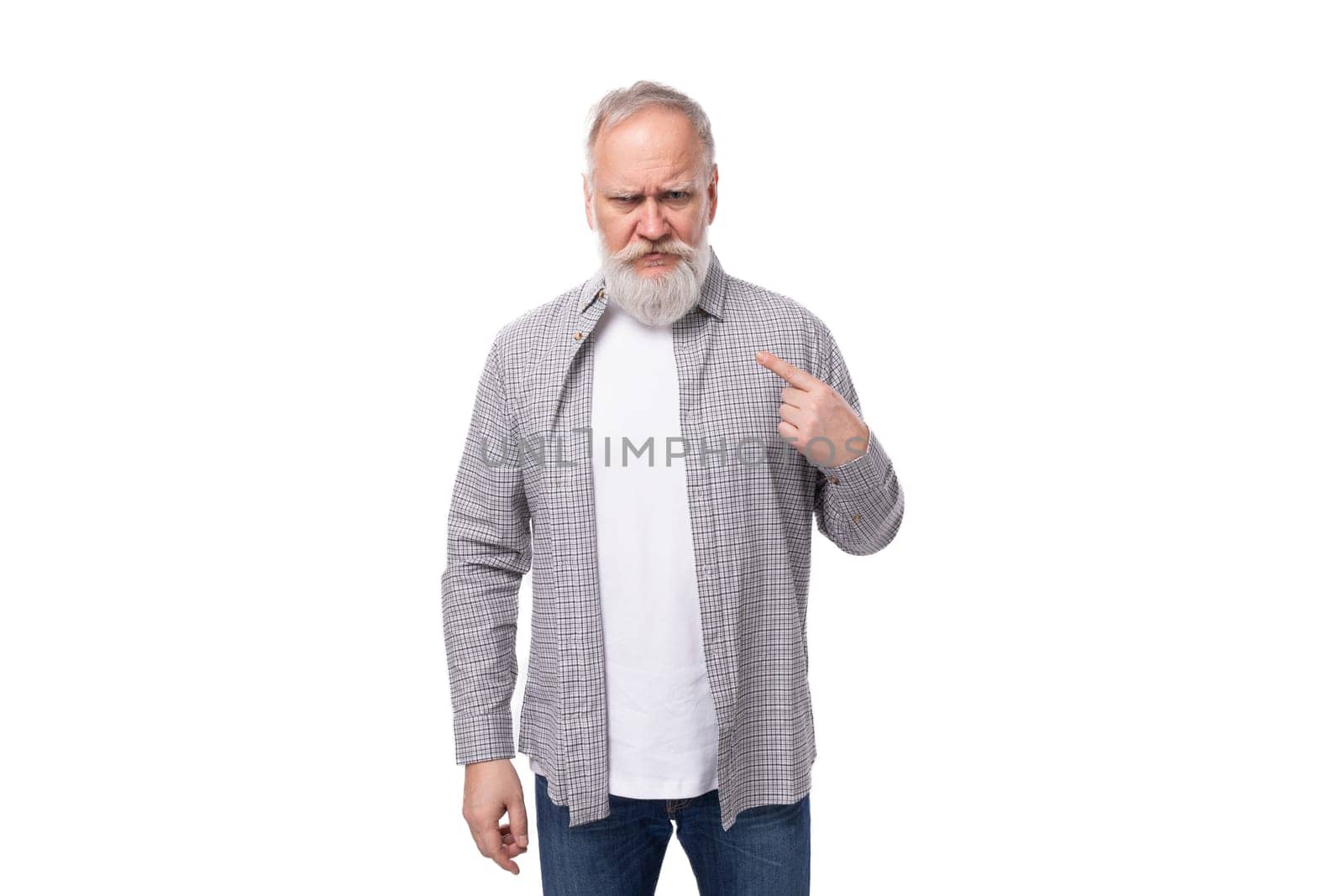 handsome mature man with white beard and mustache dressed in casual comfortable shirt and t-shirt.