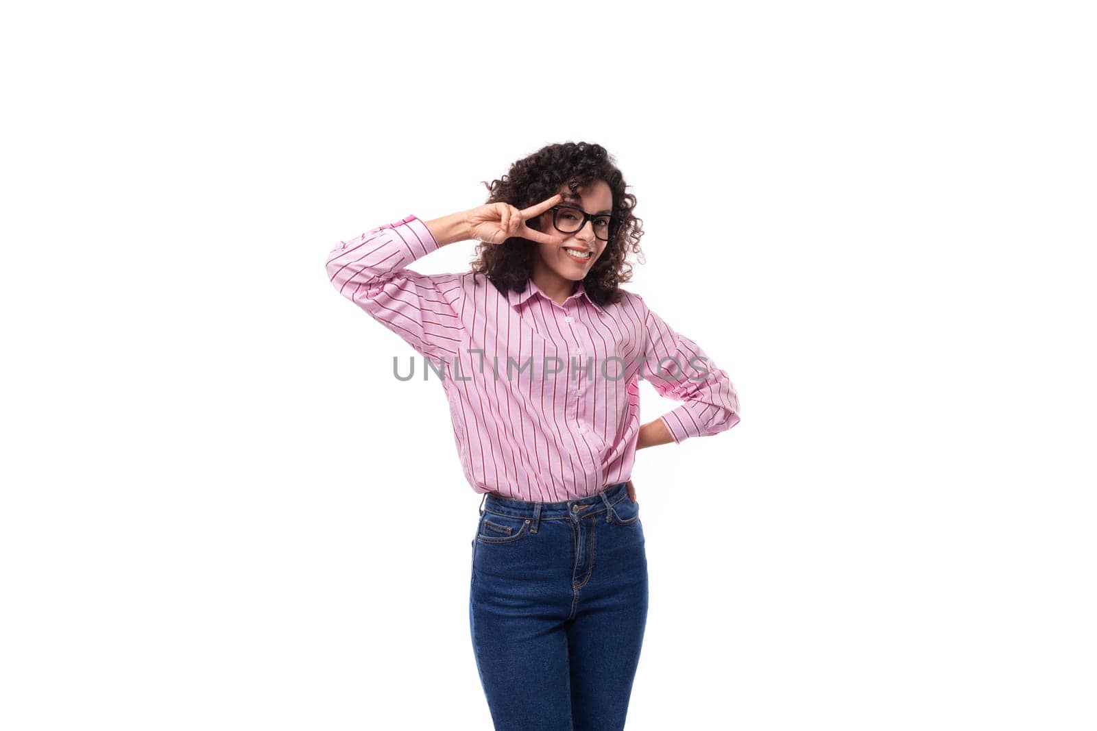 young slender caucasian woman with a curly haircut is dressed in a striped shirt by TRMK