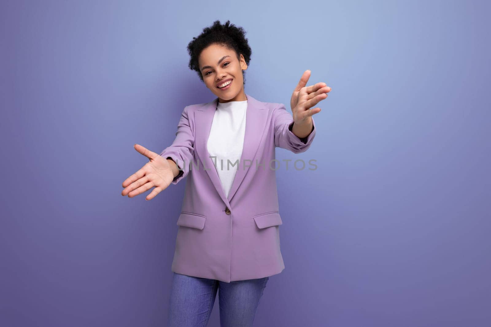 young successful latin business woman dressed in lilac jacket isolated studio background with copy space.