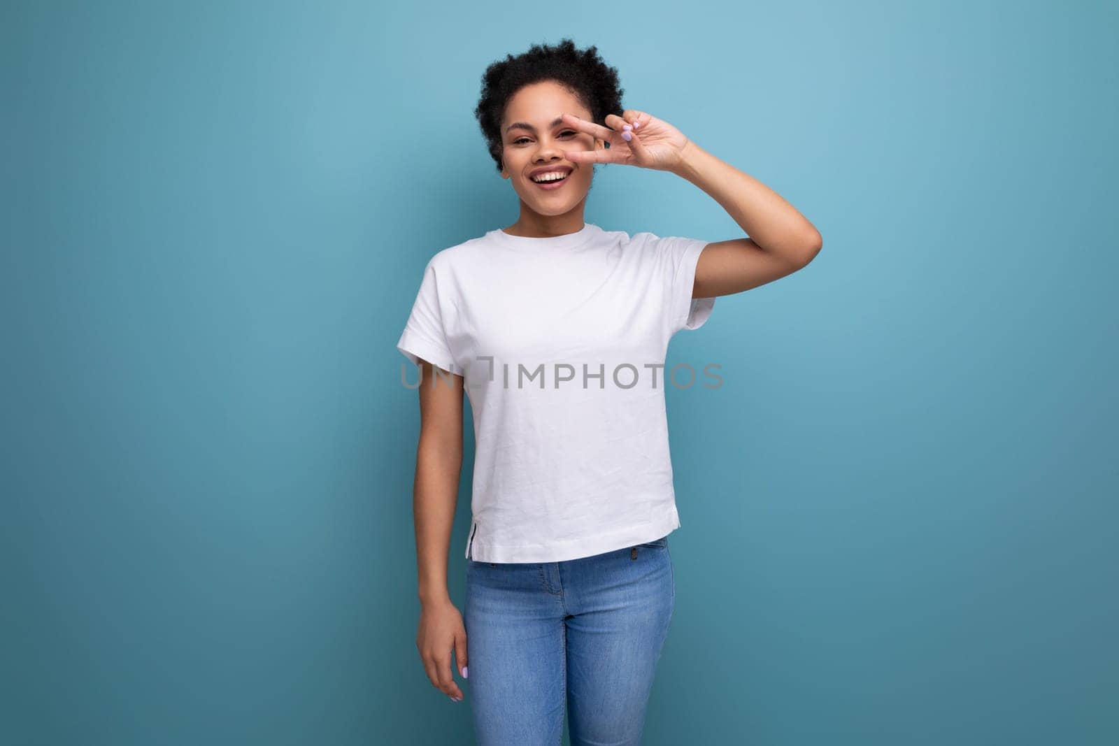 young latin woman dressed in white t-shirt with print mockup.