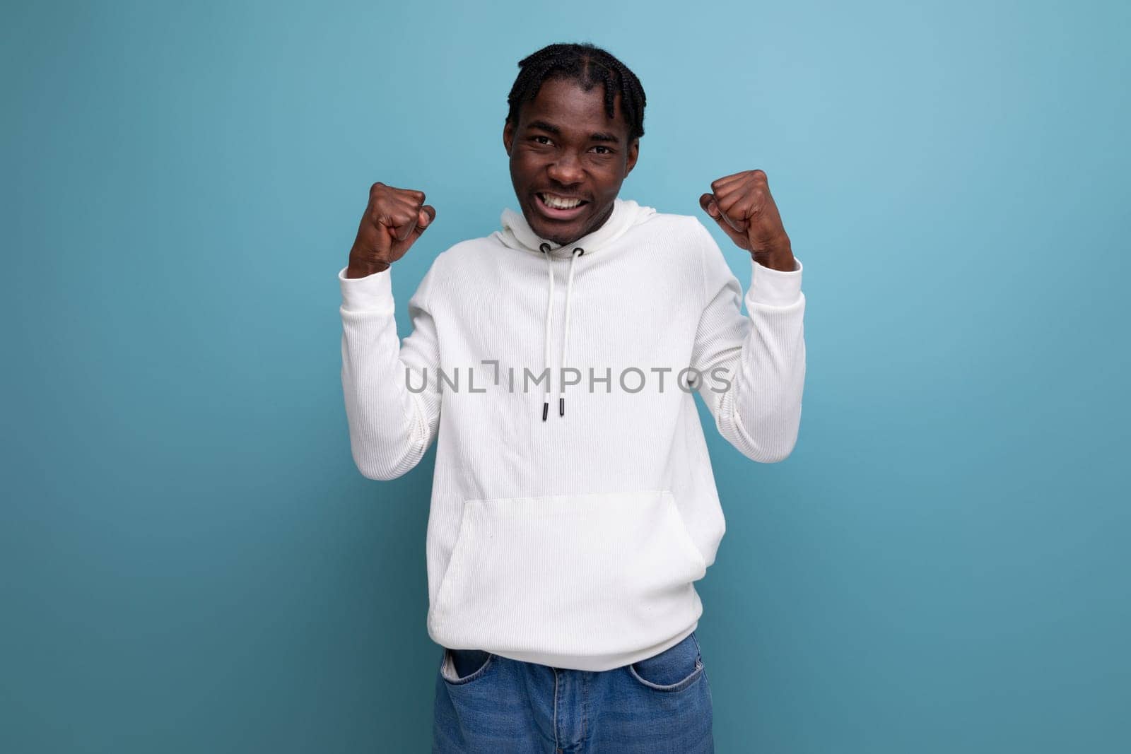 joyful winner black american young brunette man.