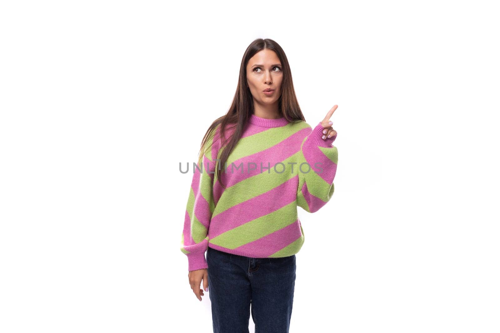 portrait of a young slender well-groomed caucasian woman with black hair dressed in a pink striped jacket on a white background with space for advertising by TRMK