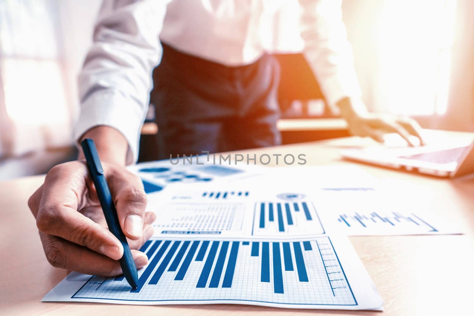 Businessman accountant or financial expert analyze business report graph and finance chart at corporate office. Concept of finance economy, banking business and stock market research. uds
